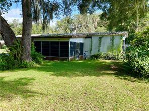 This sweet home has been remodeled to be comfy and welcoming. In addition to the two full baths and generously sized bedrooms, there is a fenced in yard and a storage shed for your outdoor needs. The enclosed screened porch can also be used for storage, or to enjoy the breeze from the water lake that's just a few blocks away. Although the area has a rural and relaxed feel, you can still get to Rt75 north and south in minutes!