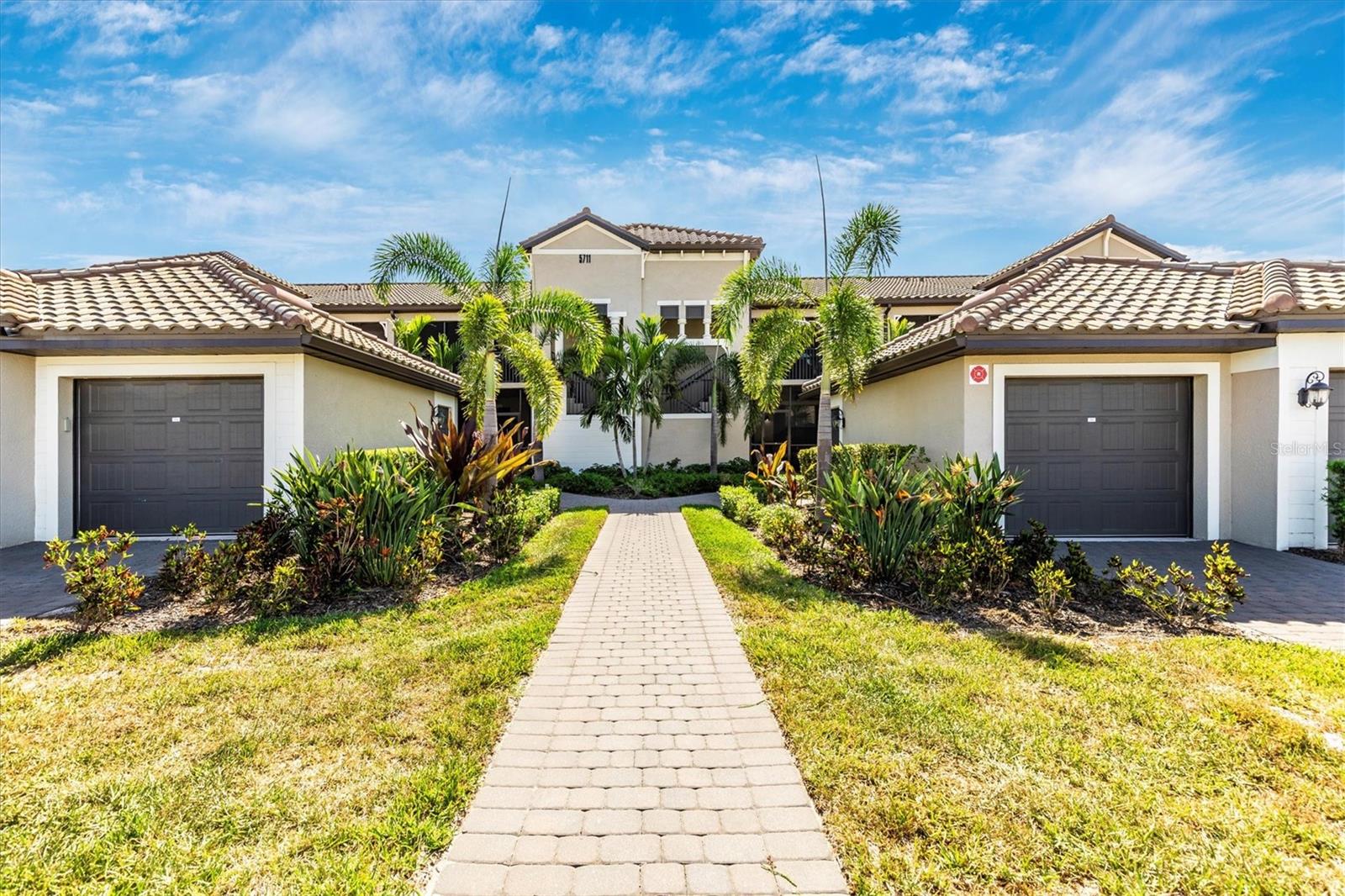 AVAILABLE NOW thru NOV 2025! Monthly or longer! Welcome to 5711 Palmer Circle, a beautifully appointed 2-bedroom, 2-bathroom condominium nestled in the Lakewood National Golf Club community in Bradenton, Florida. Built in 2022, this 1,569 sq. ft. home offers modern living with a spacious open floor plan, perfect for both relaxation and entertaining. The gourmet kitchen features stainless steel appliances, granite countertops, and ample cabinetry, with open floor plan dining and living areas. The master suite boasts a generous walk-in closet and an en-suite bathroom with dual vanities and a walk-in shower. Enjoy serene views of the golf course and water features from your private lanai, providing a perfect backdrop for morning coffee or evening gatherings. Residents of Lakewood National enjoy access to a wealth of amenities, including a championship golf course, resort-style pool, state-of-the-art fitness center, tennis courts, and a clubhouse with dining options. The community's prime location offers easy access to shopping, dining, and the beautiful Gulf Coast beaches. Experience luxury living at its finest in this exceptional Lakewood National condominium. Mothly or long term rental.