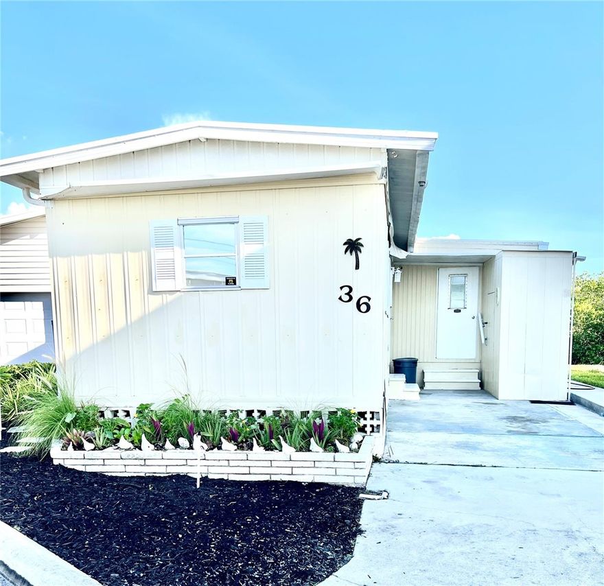 Fresh Paint! WATERFRONT IN NORTH VENICE UNDER $300,000! Bring your boat, no bridges to the Gulf. Your Very Own Private Boat Dock!! Community Boat ramp, boat dry storage, boat slips. This lovely bay front sunset cottage has stellar canal and bay views as you walk thru the door. Over 700 sf of open concept living. Living room, kitchen, dining area, new membrane roof, with new impact resistant sliders that offer an expansive canal, mangroves, bay views. Primary bedroom 11X18, built in dresser and three closets and with updated overhead fan light fixture. Butcher block counters in kitchen with newer farm sink.  Bathroom has butcher block counters with a walk in shower. Fresh Paint, New Luxury Vinyl Planking, in sand tones. Now ready for your final decorating touches to make it yours. Turn Key, just bring your boat and suitcase! Highly desirable Harbor Lights Cooperative 55+ RESORT LIVING! And no lot rent, resident owned, property taxes, monthly maintenance $250. Fish off your own dock! Must own 2 years before renting. Dock can be rented out. Walk to restaurants, shopping and doctors close by. Tennis, pickle ball, shuffle board, geo thermal pool, clubhouse and walk or bike the Legacy Trail and so much more. Harbor Lights is a 16 acre peninsula surrounded by Roberts Bay and the Intracoastal. Two car inline driveway parking with a storage shed. Seller says sell! No interior flood damage. HVAC serviced and new water heater 9/2025.