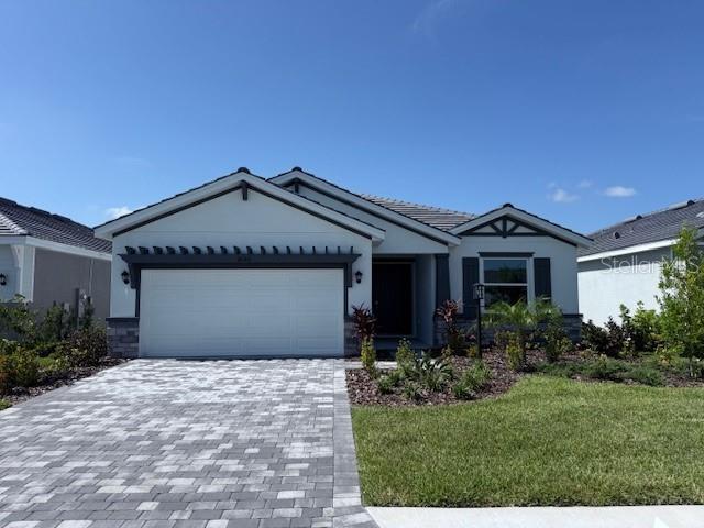 MOVE IN READY! REDTAG SALE: Receive up to $25,000 towards closing costs and special interest rates with the use of our preferred lender Now to July 31st. Self-guided tour available on this quick move-in home every day from 7am-9pm. Stop by to tour on your own time. This one-story, all concrete block constructed home has a truly open concept plan, featuring a spacious kitchen with a large granite kitchen island that overlooks a large dining area, great room, and breakfast nook which flow out onto a covered lanai. The first phase of The Resort Club amenity center is NOW OPEN, including Trade Route Coffee Kitchen, Resort Style Pool, Fitness Center, Athletic Performance Center, and Pet Park. Future phases of The Resort Club will include a poolside bar & grill, outdoor activities area, The Event Center, and The Terrace Chef’s Patio. Future amenity centers, Adventure Retreat & Cabana Corner, will include Pickleball, Tennis & Bocce Courts, Pet Park, Golf Cart Parking, Sunset Terrace, Clubhouse, Resort Pool & Spa, Resistance Pool, Poolside Cabanas & Beach Area, Outdoor Activities Area, Poolside Grilling and more. This home comes with stainless steel dishwasher, range, and microwave. Pictures, photographs, colors, features, and sizes are for illustration purposes only and will vary from the homes as built. Home and community information including pricing, included features, terms, availability and amenities are subject to change and prior sale at any time without notice or obligation.