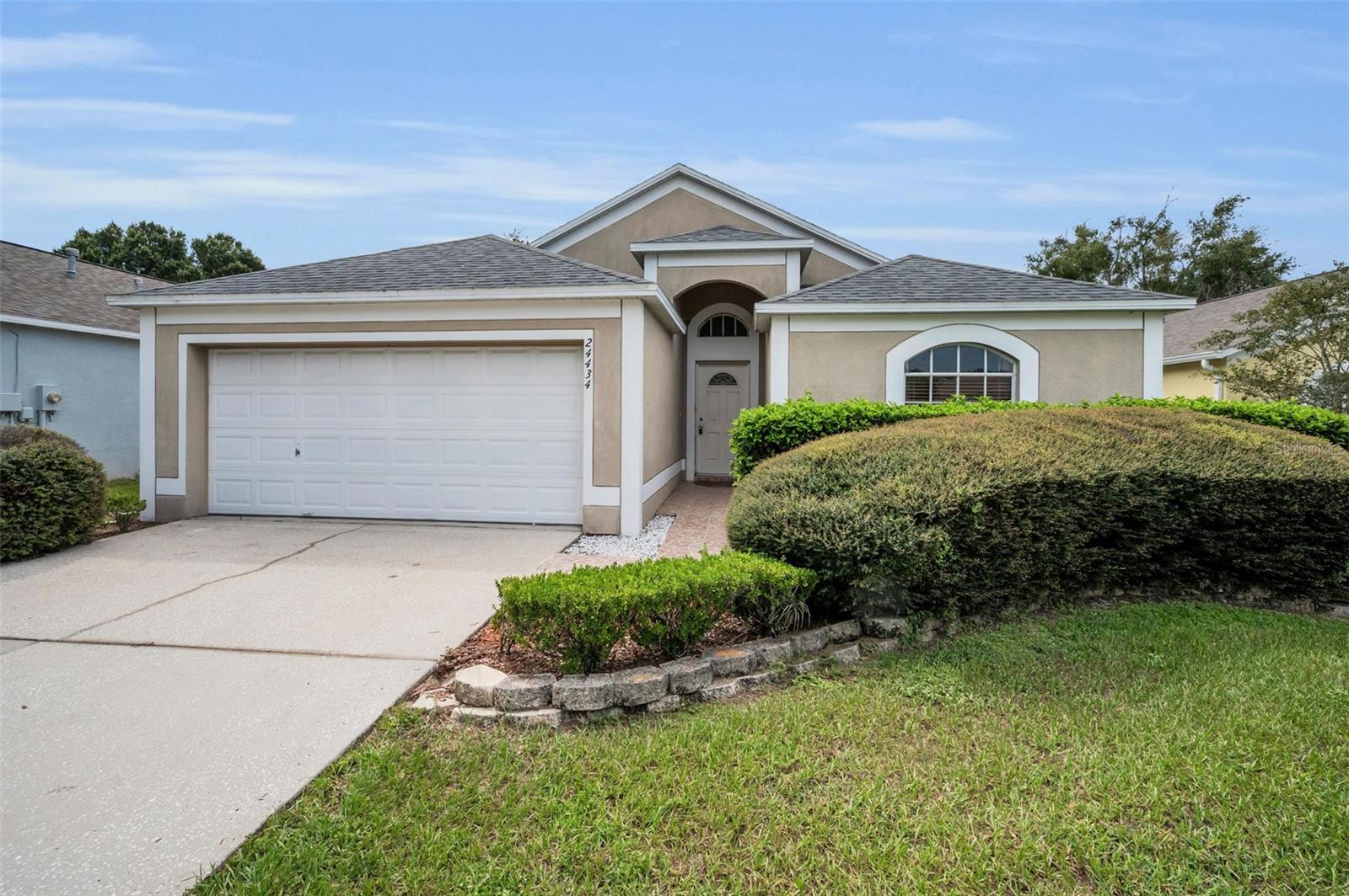 Located in the Oak Grove community of Lutz this charming 3/2 is located on a quiet cul-de-sac in a desirable Lutz neighborhood. Featuring an open floor plan highlighted with natural light and vaulted ceilings offers a warm and inviting atmosphere throughout. The kitchen with a large pantry and breakfast dining flows seamlessly into the living area, making it ideal for both everyday living and hosting guests. Additional highlights include a split-bedroom layout, new roof in 2020, 2 car garage, ample natural light, and a generous primary suite with an en-suite bathroom and large walk in closet. Enjoy privacy and outdoor living with a screened lanai and fully fenced backyard, perfect for relaxing or entertaining and plenty of room for kids or pets to play! Conveniently located near shopping, dining, and major highways, this home offers both comfort and accessibility. Don’t miss the opportunity to make this charming property your own!