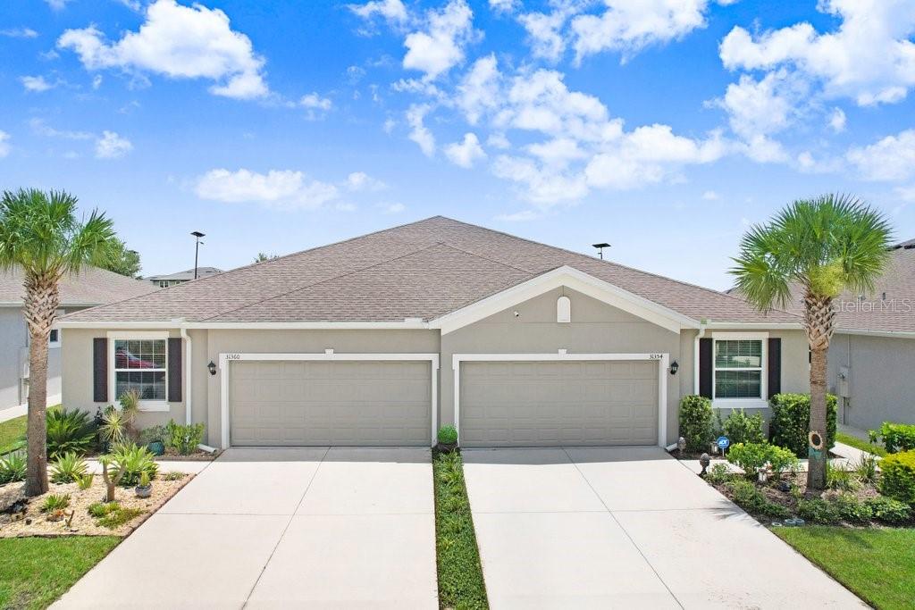 Live Where Others Vacation – Mirada Lagoon Villa.
Welcome to your dream home in the sought-after Mirada Subdivision, home of the 15-acre Crystal Lagoon, Florida’s ultimate tropical oasis. This beautiful 3-bedroom, 2-bath, 2-car garage villa combines luxury, comfort, and a resort lifestyle you can enjoy every day.
Step inside to find a light and bright open floor plan with white cabinetry, light granite countertops, and a spacious layout perfect for entertaining. Enjoy Florida living at its finest with tropical landscaping, a screened lanai for relaxing evenings, and an open lanai ideal for weekend BBQs. Built just 4 years ago, this home is not in a flood zone and offers affordable homeowner’s insurance.
All appliances are included, and lawn service is covered by the HOA, making it truly move-in ready. The HOA also includes high speed cable and internet, keeping you connected with ease.
As a Mirada resident, you’ll have unlimited access to the 15 acre Crystal Lagoon featuring a private resident beach, The Sandbar, a swim-up bar, Wibit water obstacle course, paddleboarding, kayaking, water slide, and splash area. There is also a VIP area for special occasions, and year-round activities including Bingo, Trivia, live music, foam parties, silent discos, and themed nights.
The community also offers miles of trails, golf cart and bike paths, a tot lot, and a dog park. Located in the booming San Antonio area with easy I-75 access, Mirada will soon connect to Double Branch and Abbey Crossings, offering an exciting mix of retail, dining, and entertainment.
Don’t just buy a home, embrace a lifestyle. Schedule your private showing today.