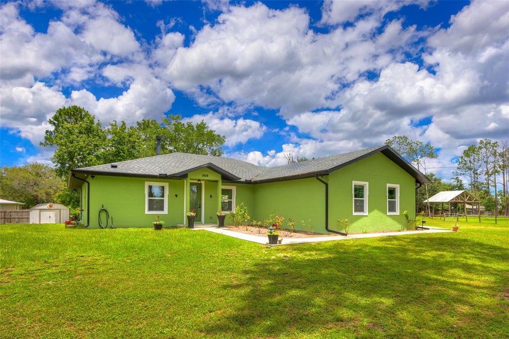 Photo of 305 Padrick Avenue, Deland, FL 32720 (MLS # V4949302)