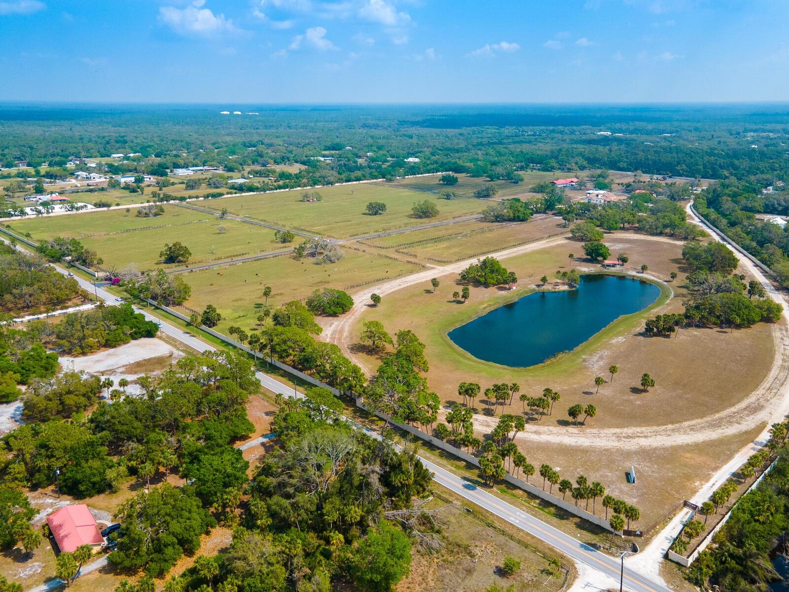 Under contract-accepting backup offers. 102 acres! This is a rare opportunity to purchase one of the few remaining large acre parcels in beautiful Sarasota County, Florida, less than 8 miles from the beach. Currently zoned OUE/OUR which will potentially allow for future subdivision of parcels. Loaded with potential, the future development possibilities are endless. Privacy abound, this walled and gated property has over six wells and two ponds on-site, with access to Blackburn Canal/Curry Creek and is currently being utilized as a residential livestock ranch containing a guesthouse, storage garages and a barn with 21 stables. The list of possible potential uses for this one-of-a-kind property includes an equestrian center/polo club, plant nursery and landscaping supply, animal hospital with boarding and sheltering, parks and open spaces, sporting events center, or luxury RV Resort. Many of these uses would support the 1,000-plus people coming to Florida per day and the surrounding Venice housing boom, including Wellen Park and the newer home communities by national and local residential builders located just minutes from the property. Only a few miles from the world-class beaches of the Gulf Coast, numerous shopping and dining options close by, and a short drive to the interstate, makes this location easy and convenient for all uses while still providing solitude and privacy. Ready for beautiful year-round weather and tired of high tax states? Come take advantage of the green belt tax benefits and lower costs of living with this beautiful Venice, Florida, unique opportunity.