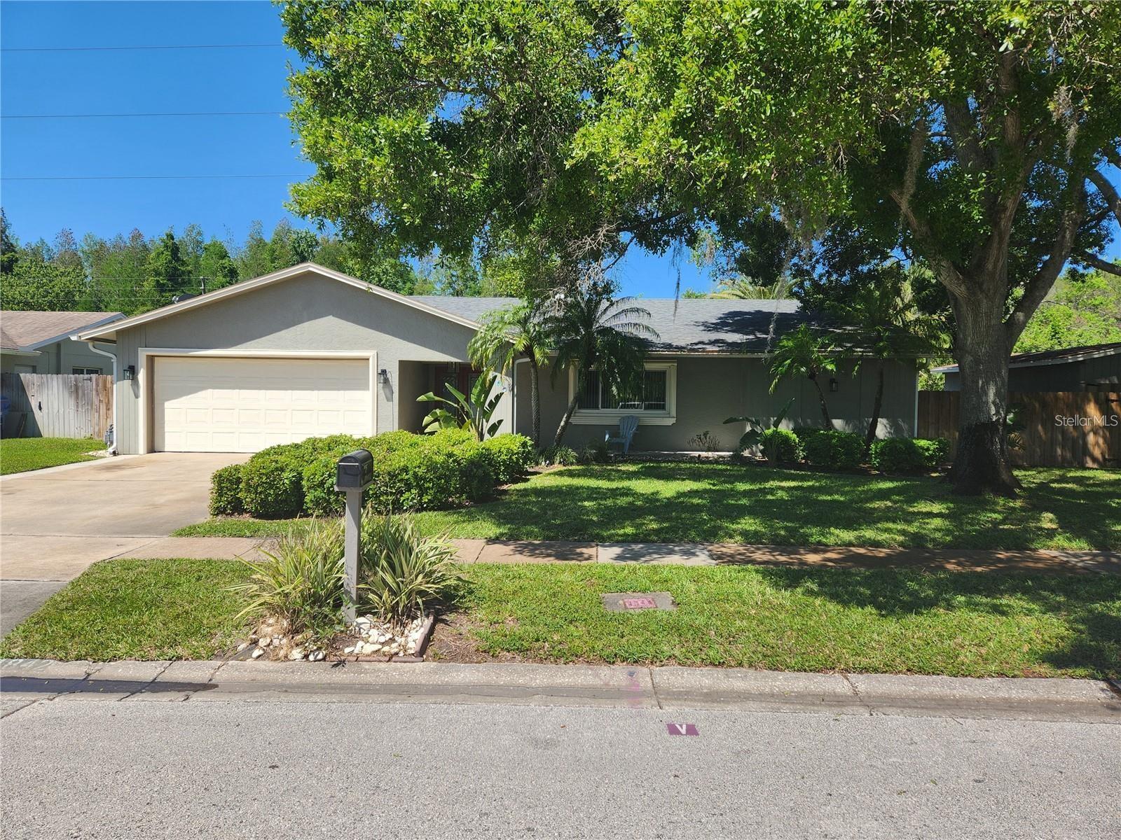 This charming home has been completely renovated. The highlight is the all-new kitchen with all-wood white cabinets that opens to the dining room and family room with fireplace, and two door walls that open to the pool deck. Nice and bright with loads of space and a unique tile floor that draws praise, complemented with 4" solid oak baseboards and 3.5" solid oak casing moldings to give it a classy feel. The very large living room has the same tile floor, with a carpeted alcove that leads to the pool deck.
The large carpeted master bedroom has its own doorwall to the pool, en-suite bath with white marbled porcelain tile floor, shower with two showerheads and a large walk-in closet big enough for him and her.
On the other side of the split plan layout are two bedrooms and the main bath. The main bath has a door to the yard and pool plus a lighted mirror. Both baths have new all-wood vanities and marble tops.
The home features plenty of storage space and extra cabinets, plus a full-size laundry room with washer, dryer and sink.
The lot is oversized with an open 12x24 boat garage/very large gazebo. Decorative lighting and an outdoor TV on the back patio, plus low voltage lighting surrounding the pool birdcage and highlighting the oasis-style landscaping makes for an excellent relaxation area day or night. The back yard is extremely private with fencing, trees and foliage turning it into your own private retreat. The deck overlooking the creek is a great place to relax, with nature all around. Several species of birds have been known to frequent the railing and sun themselves! Added bonus: the natural gas Generac generator automatically starts and runs if electricity goes out, and it's large enough to power the entire home.