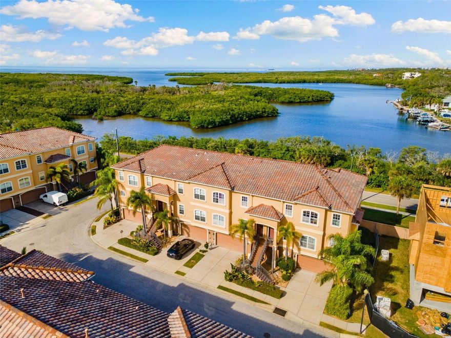 Welcome to this beautifully updated 3-bedroom, 3-bath townhome offering 2,510 square ft of living space, located in the sought-after and growing Reserves of Sea Forest within Gulf Landings. This is Florida resort-style living at its finest, with a deeded boat slip, access to a private boat ramp and day docks, tennis courts, and a waterfront clubhouse featuring a heated pool and spa. Short-term rentals are allowed, making this an exceptional option for a vacation home or investment property.

Ownership also includes membership to the exclusive Gulf Harbors Private Beach—just a quick golf cart ride away—where you can enjoy sugar-soft sand, breathtaking sunsets, and a true coastal retreat.

Inside, the kitchen is both stylish and functional with beautiful cabinetry, granite countertops, a natural gas cooktop on the center island, convection oven, new refrigerator, newer dishwasher, The open-concept layout flows effortlessly into the spacious living room, complete with a fireplace.

Step outside to the fully screened wrap-around balcony—perfect for outdoor dining or relaxing.

Upstairs, the expansive primary suite is a true retreat featuring its own gas fireplace, private screened balcony, walk-in closet, and a spa-inspired ensuite with split vanities, granite countertops, a whirlpool tub, and a separate shower. A generous secondary bedroom offers its own ensuite and walk-in closet, with the laundry conveniently located between both bedrooms. The third bedroom, currently used as a home office, is located on the main level alongside a full guest bath.

Additional highlights include an elevator for easy vertical living, and a massive two-car garage with workspace. From the garage, you’ll access a large screened patio ideal for grilling and entertaining.

The HOA covers exterior maintenance, roof, flood and building insurance, landscaping, reserves, trash service, common-area taxes, and maintenance of the boat ramp, docks, waterfront clubhouse, pool, spa, and tennis courts.

Enjoy a low-maintenance, high-lifestyle experience in this golf-cart-friendly community—spend your evenings cruising to the private beach or heading down Main Street to soak in the charm and culture of downtown New Port Richey. Schedule your private showing today.