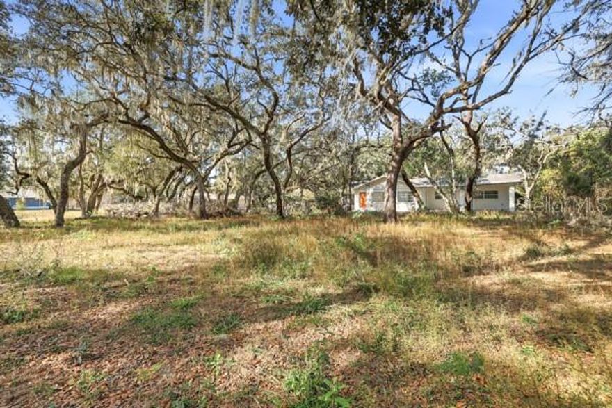 Discover the perfect canvas for your future home on this 0.26-acre vacant lot, offering flexibility and freedom with no HOA restrictions and no lease minimums. Whether you’re ready to build your dream home or simply invest in additional space, this property provides public water electric with need of a septic system.
For buyers seeking more, an adjoining secondary listing is available 34582 ORCHID PKWY, DADE CITY FL 33523-8858 or MLS#TB8457354 features a 3-bedroom, 2-bathroom home with 1,754 sq ft of living space. Together, both parcels create an impressive 0.67 acres, blending privacy, expansion potential, and lifestyle versatility. Sold together or separately.