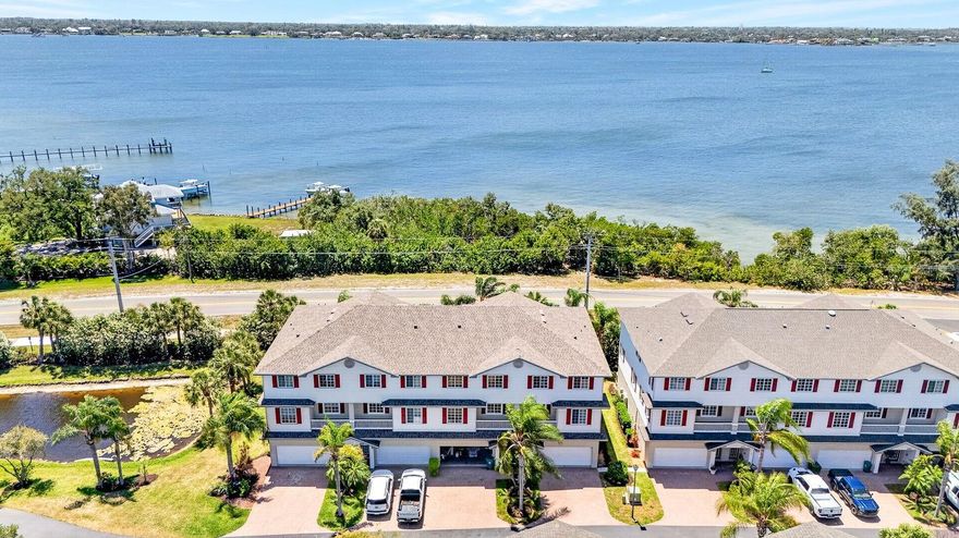 Welcome to 3607 10th Ln W, Palmetto, FL 34221—a rare end-unit waterfront home on the Manatee River offering tropical views, generous space, stylish updates, and one of the most desirable locations in the community. Positioned on the sought-after west end, this beautifully updated residence enjoys a quieter setting, direct water views, added privacy, and bright natural light from extra end-unit windows. Opportunities with this combination of location, layout, and upgrades are hard to find.

Built with elevated block construction, this spacious home features 4 bedrooms, 3.5 bathrooms, and two ensuite bedrooms, creating a flexible floor plan with room to spread out. A split bedroom layout adds privacy, while the downstairs ensuite with private entrance works well as a guest suite, home office, gym, in-law suite, or bonus living space.

Inside, you’ll find updated porcelain tile throughout the main living area and downstairs, soaring 9-foot ceilings, updated lighting, plantation shutters and a bright open feel. The updated kitchen is both stylish and functional, featuring quality cabinetry, granite countertops, generous storage, and plenty of workspace for cooking and entertaining. A whole-house water filtration system adds another valuable upgrade.

The spacious primary suite offers a relaxing retreat with dual walk-in closets and an updated bath featuring a double vanity and walk-in shower. The upstairs laundry area, located just outside the primary bedroom, adds everyday convenience.

A standout feature is the private elevator, making movement between levels easy while adding comfort and convenience.

Outdoor living is a true highlight. Enjoy direct Manatee River views, passing boats, and beautiful Florida sunset skies from balconies on the second and third floors, plus an open ground-level patio area perfect for relaxing or entertaining.

Additional features include a 2021 roof, private driveway, and a spacious 2-car garage with extra storage for bikes, kayaks, tools, or beach gear.

This pet-friendly community has no dog weight restrictions and offers a community pool and kayak launch. Marina slips may be available for purchase (subject to availability), and nearby guest parking adds convenience for visitors.

The low HOA fee includes lawn care, landscaping, water, sewer, trash service, and exterior building painting. There are also no CDD fees, helping keep ownership costs lower. A 3-month minimum rental policy offers added flexibility.

Enjoy close access to the Bradenton Yacht Club, pickleball courts, shopping, dining, Snead Island, and Emerson Point Preserve, known for scenic walking trails, kayaking, wildlife, and beautiful coastal views. You’re also just a short drive to Gulf beaches, I-75, I-275, and nearby airports.

If you are looking for a Palmetto FL waterfront home for sale with river views, sunset views, an elevator, low HOA fees, and extensive updates, this is a must-see opportunity. Schedule your private showing today.