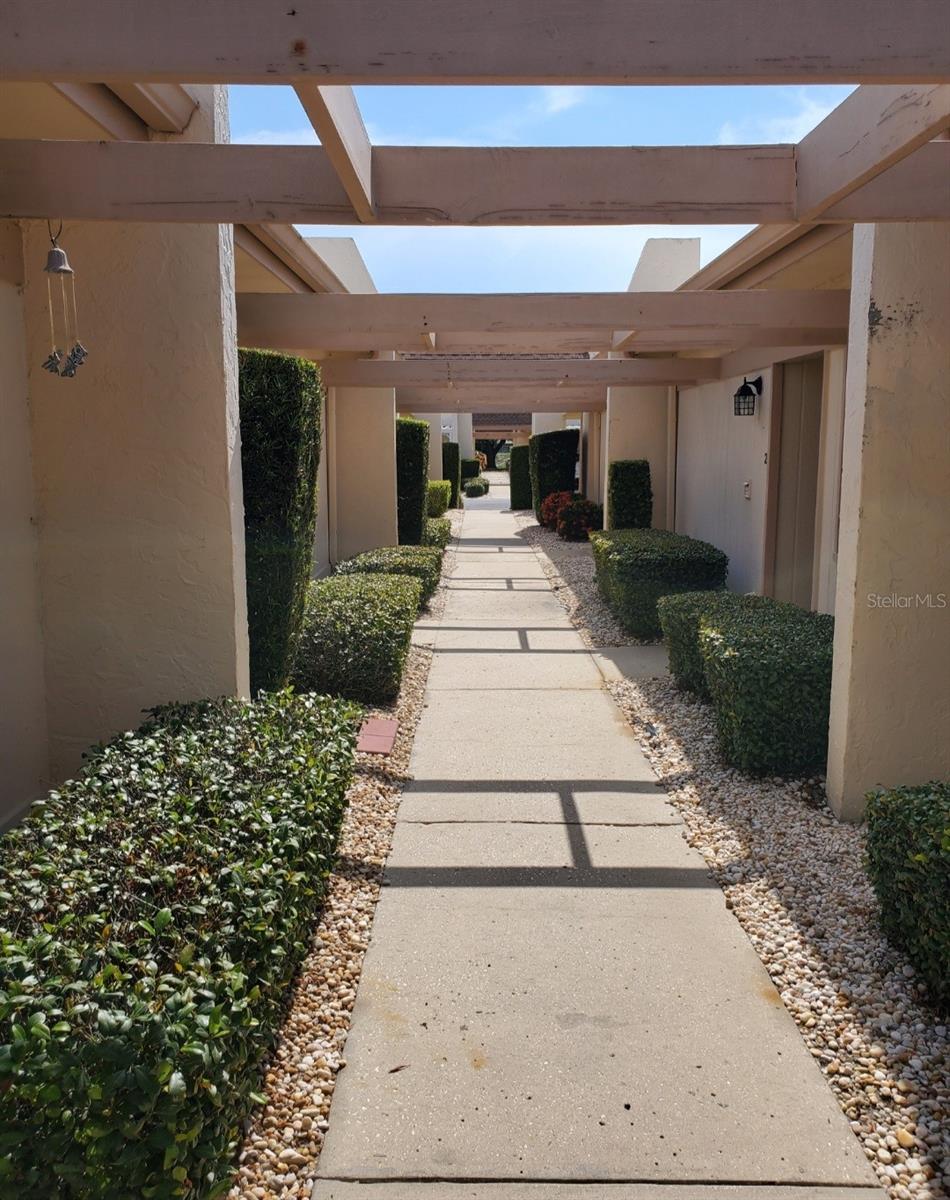 Charming one-bedroom, one-bath villa in Timber Oaks – Fairview Villas, an active 55+ community. The home offers a functional and comfortable floor plan, convenient in-home stack-able washer, dryer in laundry closet for low-maintenance living, Huge hall closet for ample storage. and an even bigger walk in closet in the master bedroom. A Safe step walk-in tub/shower, therapy massage, this tub/shower does it all, ( cost was $13000.00). New refrigerator, Newer hurricane rated impact sliders—perfect for year-round or seasonal enjoyment. assigned covered parking for your car and out door storage plenty of room for your holiday items or your camping gear. Make this home your Florida life style by putting your own touches on it.
Then step outside your front door into a community designed for connection and activity. The clubhouse boasts a heated pool and spa, fitness center, woodshop, craft and sewing rooms, computer lab, library, and an auditorium for parties, dances, and events. Beyond the clubhouse,
you’ll find scenic walking areas, a lakeside pavilion perfect for socializing with friends, and a full calendar of community events to keep life vibrant. With maintenance services included, Timber Oaks makes living easy while offering endless ways to stay active and engaged.