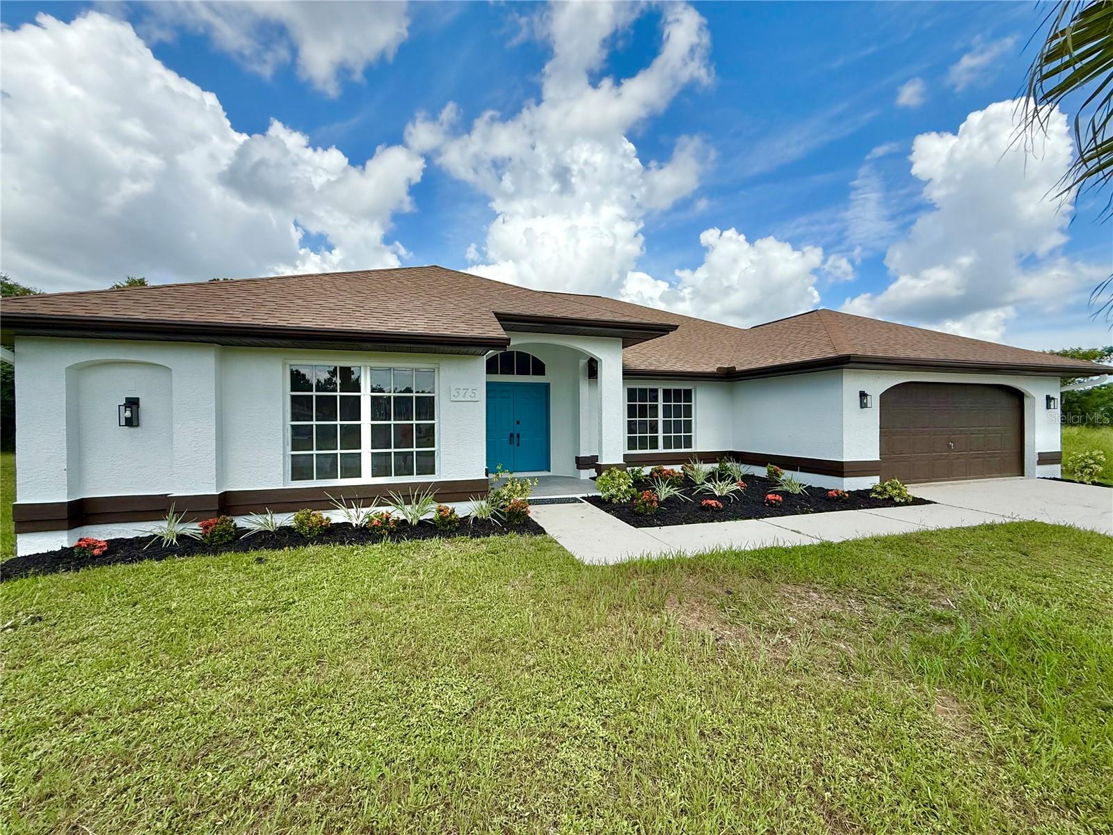 One or more photo(s) has been virtually staged. WELCOME TO PERFECTION IN THIS 4 BEDROOM, 2-bath, 2-car garage POOL HOME located in a great area of newer homes and NOT IN A FLOOD ZONE. This beautifully designed split plan immediately impresses with outstanding curb appeal, accented by rich banded details, a soaring covered entryway with double doors, and striking exterior illumination. Step through the true foyer and discover vaulted ceilings, a separate dining room, and two spacious living areas filled with abundant natural light and nice pocketing sliders that draw your eye toward the privacy and inviting pool. The chef-worthy kitchen is a standout, featuring gorgeous quartz countertops with a matching backsplash, brand new stainless steel appliances, shaker cabinetry, decorator hardware, and a convenient breakfast bar perfect for casual dining or entertaining. The master suite is a tranquil retreat with its own private pool access, walk-in closets, and a luxurious en-suite bath offering dual sinks, a modern open concept rain shower, quartz finishes, and light-up touch mirrors for a spa-like experience. Guests will enjoy three additional generously sized nicely appointed bedrooms with serene views, while the second bathroom is equally impressive with oversized quartz tile from floor to ceiling, a matching vanity, and a modern touch mirror. At the heart of the home, the angular pool creates a resort-like atmosphere complete with a wide three-step walkout, side seating, and expansive areas for lounging, sunbathing, or relaxing in the shade under the covered screened lanai. A terrific space to enjoy anytime of day swimming or relaxing with friends or family. Three pocketing sliders seamlessly connect indoor and outdoor living, making this home an entertainer’s paradise. Enjoy the added convenience of an inside laundry room with its own soaking basin, as well as a full two-car garage. With no HOA restrictions and a large backyard, this property is ideal for those seeking luxury, comfort, and total peace of mind all in one remarkable package. Located in Southwest Florida, this property offers year-round access to boating, fishing, golfing, various Gulf beaches, natural resources, dining establishments, parks, public tennis courts, and shopping. Culturally enriching events are held regularly, with multiple baseball parks in close proximity. Conveniently situated just minutes from the Tampa Bay Rays Training Stadium, shopping mall and numerous parks, and a short 35-minute drive from multiple Gulf beaches, this residence provides exceptional accessibility. The Punta Gorda Regional Airport, served by Allegiant Air, is located a mere 12 miles away. Notably, Fisherman's Village and the Historic District, with their diverse array of dining and shopping options, are approximately 9 miles away. DON'T DELAY, this one of a kind home with unmatched views is priced to sell ...SCHEDULE YOUR SHOWING TODAY!