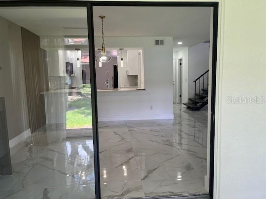 Photo of 8217 Breeze Cove Lane, Orlando, FL 32819 (MLS # O6389651)