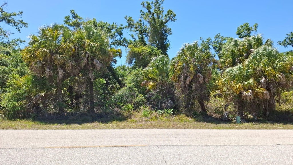 Photo of 243 Warrington Boulevard, Port Charlotte, FL 33954 (MLS # O6426881)