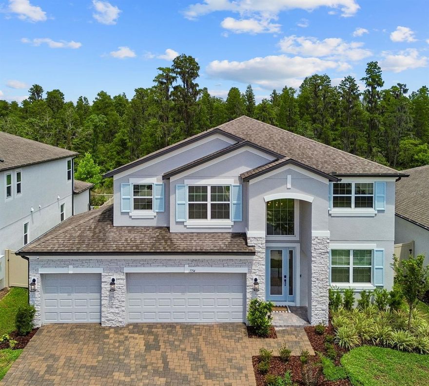 PREMIUM CONSERVATION LOT | NEW SALTWATER POOL | FOUR-CAR GARAGE | NO CDD FEES.

Welcome to 7754 Hemlock Seed Drive in Wesley Chapel, FL — a beautifully upgraded 5-bedroom, 3-bath home offering over 3,500 square feet of stylish and functional living space in a friendly gated community.

Built by M/I Homes, this two-story home features an open-concept layout filled with natural light, spacious living areas, and thoughtful upgrades throughout. The gourmet kitchen includes high-end appliances, modern cabinetry, and a large center island perfect for entertaining and everyday living.

The spacious owner’s suite offers a private retreat with a walk-in closet and well-appointed en-suite bath, while the additional bedrooms provide flexibility for family, guests, or a home office.

Enjoy Florida living at its best with a custom fireplace and a stunning saltwater pool, built in December 2024, overlooking a beautiful conservation area for added privacy and peaceful views. The premium homesite and spacious backyard create the perfect setting for relaxing or entertaining outdoors.

Additional highlights include:
 - Four-car garage;
 - Complete Ring security system with cameras, video doorbell, and motion sensors;
 - No CDD fees;
 - Spacious walk-in closets;
 - One bedroom and full bathroom downstairs perfectly designed for guests;

Conveniently located near shopping, dining, parks, and top Wesley Chapel amenities, this home combines modern comfort, upgraded features, and an exceptional location.