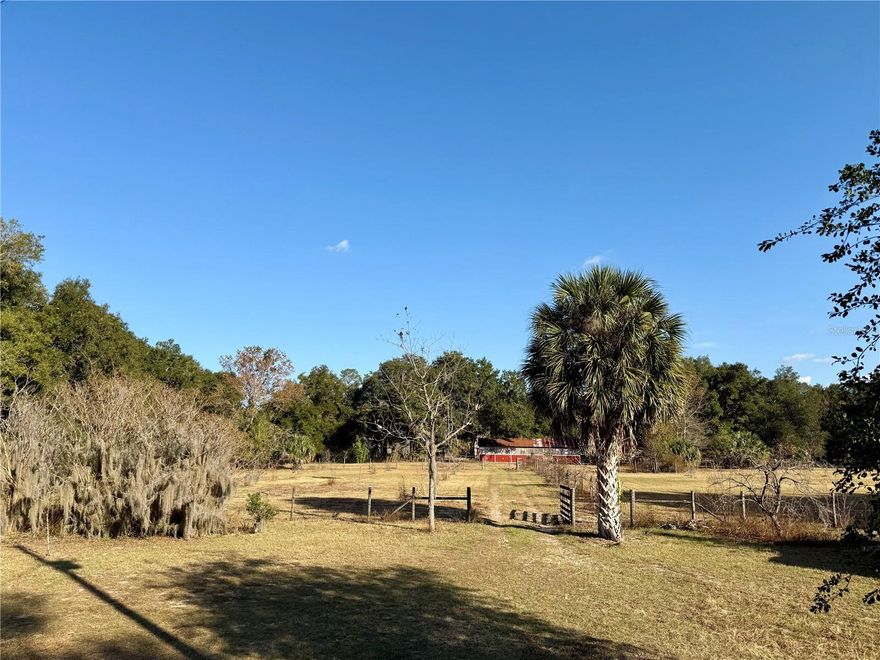 Unique investment opportunity in a 10.76-acre homestead and farm that includes a four-bedroom/two-bathroom 3,140 sq-ft home with a two-car garage, a four-bedroom/two-bathroom 2,025 sq-ft double wide in excellent condition, a 1,408 sq-ft pole barn, an 861 sq-ft workshop, another 800 sq-ft workshop, a 421 sq-ft storage shed, a 1,725 sq-ft stables, and established pecan and permission orchards. The list of amenities is impressive and offers a variety of possibilities for a homebuyer interested in an agricultural enterprise or hobby.

The property has two wells, two septic systems, and the electricity service is provided by Clay Electric (the most affordable provider in the area).

The property is conveniently located on SR 26, just south of Lake Santa Fe. The Lake Santa Fe boat ramp is exactly half a mile from the property, and downtown Melrose is exactly 1 mile from the property. Downtown Gainesville is 17 miles away (a 20-minute drive), and the University of Florida is 18 miles away (a 25-minute drive).

The property has been appraised, and the seller has listed under appraised value.

A property like this offers any potential buyer the opportunity for a private lifestyle, on a sizable acreage, in a quaint town while maintaining the convenience of being located close to major hospitals, universities, and other major amenities and services. It truly offers the best of both worlds in that respect.