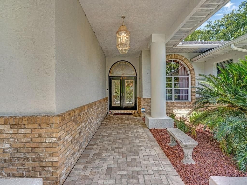 Photo of 8711 Crescent Forest Boulevard, New Port Richey, FL 34654 (MLS # TB8474866)