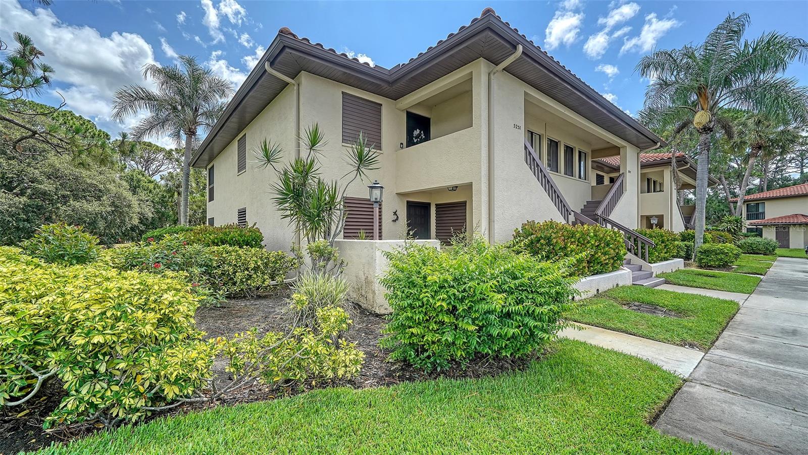 Second floor, with no one above you, two-bedroom, two-bath condominium in prime location! A quiet, tucked-away cul-de-sac welcomes you to this spotless retreat in the heart of The Meadows, a 1,650-acre park-like oasis in a thriving location. Inside, you'll love the bright and airy ambiance, enhanced by walls of sliders that invite natural light and peaceful greenbelt views. Easy-care tile and laminate floors flow throughout with no carpet anywhere! The spacious screened-in lanai is ideal for morning coffee, unwinding with a good book or simply soaking in the serene surroundings. The primary suite pampers you with dual closets and a walk-in shower. All with an interior laundry room, a tranquil green belt setting, a block to the heated community pool and near all the fun The Meadows has to offer. The Meadows, 1,600 park-like acres in a thriving location, is a resort lifestyle community 15 minutes from downtown. Residents enjoy 14 miles of trails, fun activities, fitness center, Junior Olympic pool, 10 pickleball courts, dining venues plus pay-to-play in a top-notch tennis complex. You’ll live near award-winning beaches, remarkable arts and culture, Nathan Benderson Park, Mote SEA Aquarium, Whole Foods, Trader Joe’s and The Mall at University Town Center, a world-class shopping, entertainment and dining destination. A fabulous Florida lifestyle awaits. A 2025 air-conditioning system, 2002 tile roof, interior laundry room and above flood plain in zone X.