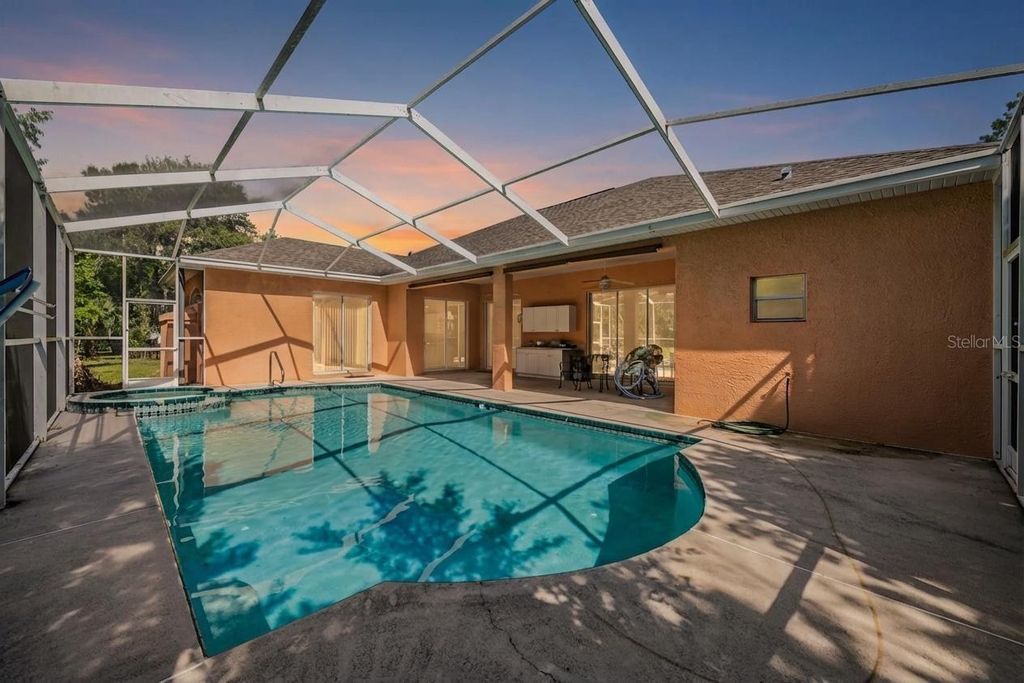 Photo of 13566 Rudi Loop, Spring Hill, FL 34609 (MLS # TB8497248)