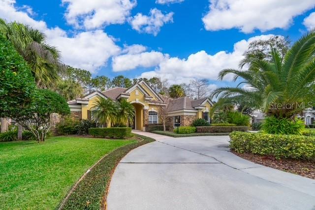 This spacious canal front property in gated Lake forest has an open split floor plan 1 story home boasts 4 bedrooms and 3.5 baths with over 3400 sqft of living space. Three car side entry garage, Circular driveway. Massive island in the spacious kitchen has stainless appliances and overlooks the family room and pool! There is a separate game room just beyond the family room which is perfect for a separate play area. Connected to the game room there are two additional bedrooms with a full bathroom which has access to the backyard. Spacious master bedroom includes a jetted tub and separate shower with walk in closet. You can canoe in the canal in the backyard! Ideal floor plan for a large family just down the street from the clubhouse. This guard gated community offers a pristine 55-acre lake with a 10,000 sqft clubhouse, fitness center, 6 lighted tennis courts, beach volleyball, basketball court,, Olympic sized swimming pool, and security, all paid for with your HOA dues. Minutes away from major highways, shopping and Seminole Town Center. Don't miss this opportunity to own a home in this wonderful community.