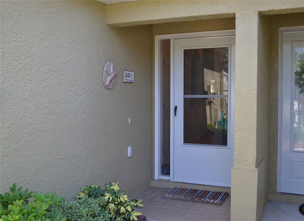 Photo of 11135 Kapok Grand Circle, Madeira Beach, FL 33708 (MLS # TB8439392)