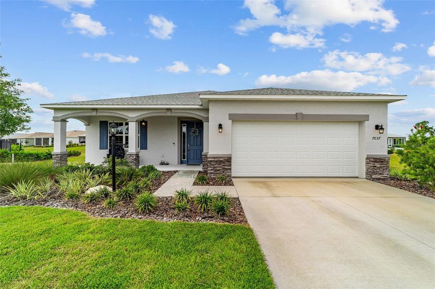 Looking for a SPACIOUS nearly new 3 bedroom, 2 bath home on a LARGE LOT in Weybourne Landing at On Top of the World with premium upgrades and open concept living? This 2024 built residence offers over 2,100 square feet, more than $40,000 in builder upgrades, and sits on a cul de sac lot in one of Ocala’s premier 55+ communities. Step through the wide welcoming foyer and immediately notice the upgraded sleek marble inspired flooring that flows throughout the main living areas. Two guest bedrooms and a full bath are thoughtfully positioned to the left, creating comfort and separation for visiting family and friends. To the right, the home opens into a bright, expansive great room anchored by an oversized island that comfortably seats six and features a built-in sink. Whirlpool stainless steel appliances, including a gas range, elevate the kitchen, while the open dining and living areas provide seamless flow for entertaining. The living room showcases an electric fireplace with TV mount ready above, tray ceilings, and recessed lighting that add architectural dimension. The spacious primary suite offers dual walk in closets and a well appointed ensuite with dual sinks and a large walk in shower. Step out to the wide screened lanai to enjoy morning coffee or unwind in the evenings. Residents of On Top of the World enjoy resort style amenities including golf, indoor and outdoor pools, fitness centers, tennis and pickleball courts, scenic walking trails, hobby studios, clubs, a dog park, and gated security. Ideally located just minutes from Sholom Park, the Appleton Museum of Art, Silver Springs State Park, and the World Equestrian Center, plus shopping, dining, and medical facilities nearby.