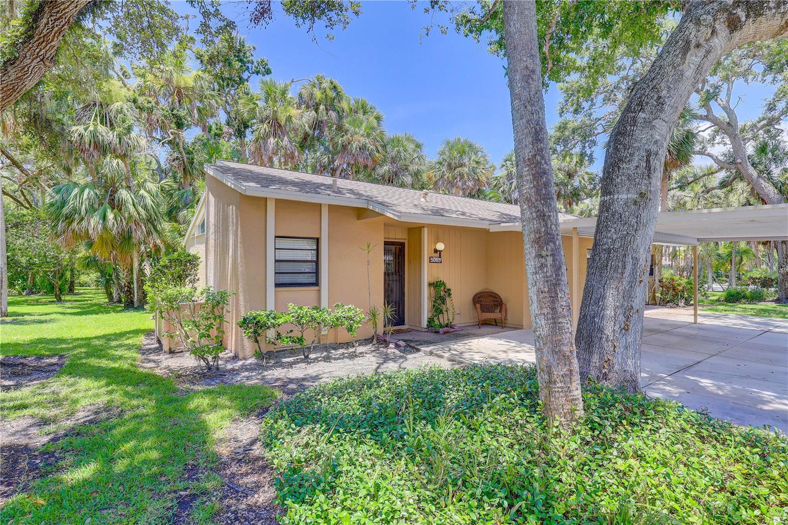 Welcome to this spacious and adorable home located in the charming community of Village Gardens! This home features tasteful laminate flooring with additional sub padding, tile flooring, large living/dining combo with vaulted ceiling, lots of natural lighting and fresh paint in the living room and bedroom! The primary bedroom offers ample amounts of space with dual closets and it's own access to the screened in patio! The community offers a pool, tennis courts and much more! Located minutes from Sarasota airport, UTC mall, tons of shopping and restaurants! It's a must see, schedule your tour today!