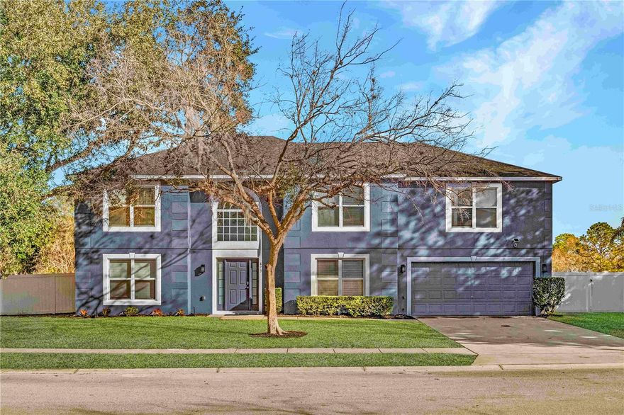 One or more photo(s) has been virtually staged. Welcome to this exceptional pool home in the highly desirable community of The Trails, offering 5 bedrooms, 3 full bathrooms, and an additional office/guest room designed for both flexibility and comfort. The first floor features beautiful wood-look tile flooring throughout, creating a seamless and durable living space. The fully remodeled kitchen is the heart of the home, showcasing elegant quartz countertops, a striking vent hood, and a full suite of stainless steel appliances. The living room area features an electric fireplace and beautiful built-in wood open shelving. A full bathroom on the main level perfectly complements the office/guest room, making it ideal for visitors or multi-generational living. Upstairs, the spacious primary suite provides a private retreat. The laundry area is thoughtfully located on the second floor, eliminating the need to carry laundry up and down the stairs. The washer and dryer are included for added convenience. Four additional bedrooms and a generous loft/family room area offer additional gathering space — perfect for movie nights, a playroom, or a secondary living area. Major updates include a roof replaced in 2018 with the flat roof over pool patio replaced in December of 2023, a new AC system installed in 2023, a fully remodeled kitchen, newer flooring, and full interior and exterior repainting, providing peace of mind. Step outside to enjoy the large white vinyl-fenced backyard featuring a saltwater pool with screen enclosure, while still leaving plenty of yard space for entertaining, play, or future outdoor enhancements. A stone-stacked outdoor fire pit creates the perfect setting for gathering. This beautifully maintained home combines thoughtful upgrades, a functional layout, and inviting outdoor living. Do not miss out on this gem today!