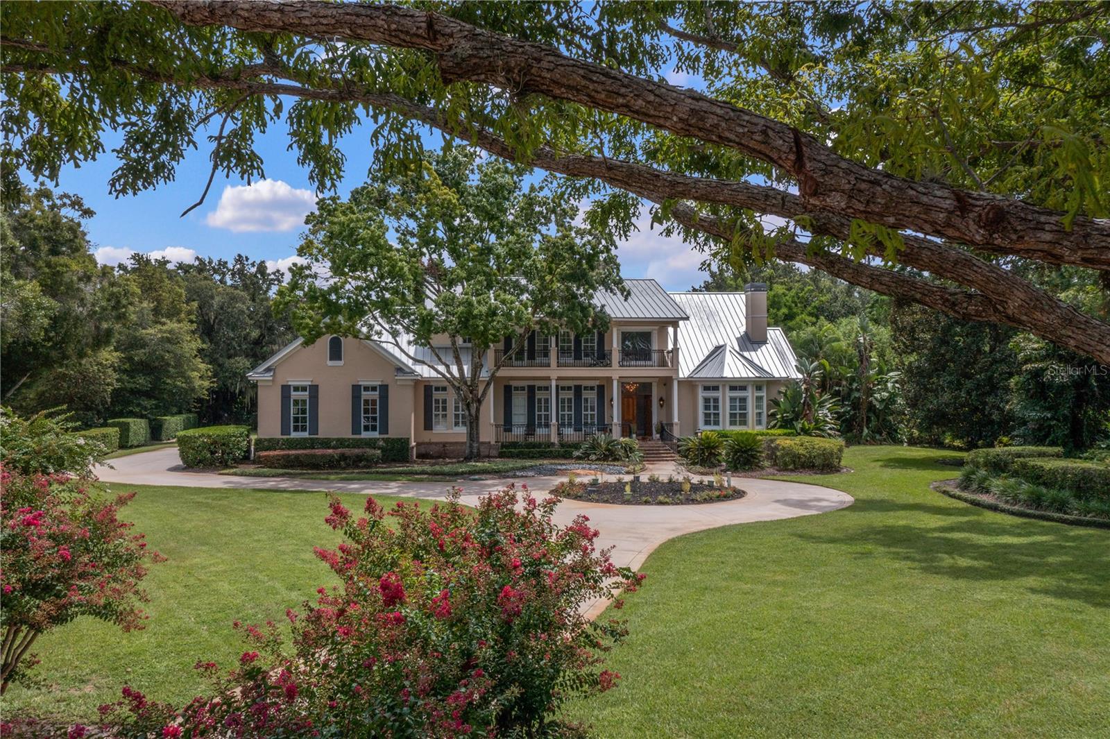 Welcome to 3413 Lilas Court, a stunning residence located in the well renowned community of Chaine Du Lac. This exceptional home blends modern luxury with timeless elegance, offering a perfect combination of comfort and style. Upon arrival, you’re greeted by a beautifully landscaped front yard and an inviting exterior that sets the tone for the sophistication within. The grand entrance, complete with a charming front porch, leads to a spacious foyer, opening into a light-filled, open-concept living area that radiates warmth and refinement.
At the heart of the home is the expansive living room, featuring soaring ceilings and large windows that bathe the space in natural light. The chef’s kitchen is a true highlight, showcasing high-end stainless-steel appliances, custom cabinetry, a large island, and sleek quartz countertops. Adjacent to the kitchen, the dining area offers a welcoming space for both casual meals and elegant entertaining. The primary suite serves as a luxurious retreat, complete with a spacious layout, a walk-in closet, and an en-suite bathroom that boasts dual vanities, a soaking tub, and a glass-enclosed shower. An additional flex room off the primary bedroom provides ample space to be used as an office. On the first floor, you’ll also find another spacious suite, with two additional bedrooms located upstairs. Outside to your private sanctuary, where a beautifully landscaped backyard awaits. Enjoy outdoor dining and relaxation on the covered patio, while the sparkling pool and spa provide the perfect setting to unwind and enjoy Florida’s year-round sunshine. Additional features of this remarkable home include a cozy family game room, a convenient laundry room, and a three-car garage. Located just minutes from fine dining, world-class shopping and all the area attractions, this location quite simply can't be beat. Don’t miss your opportunity to own this one-of-a-kind Chaine Du Lac residence.