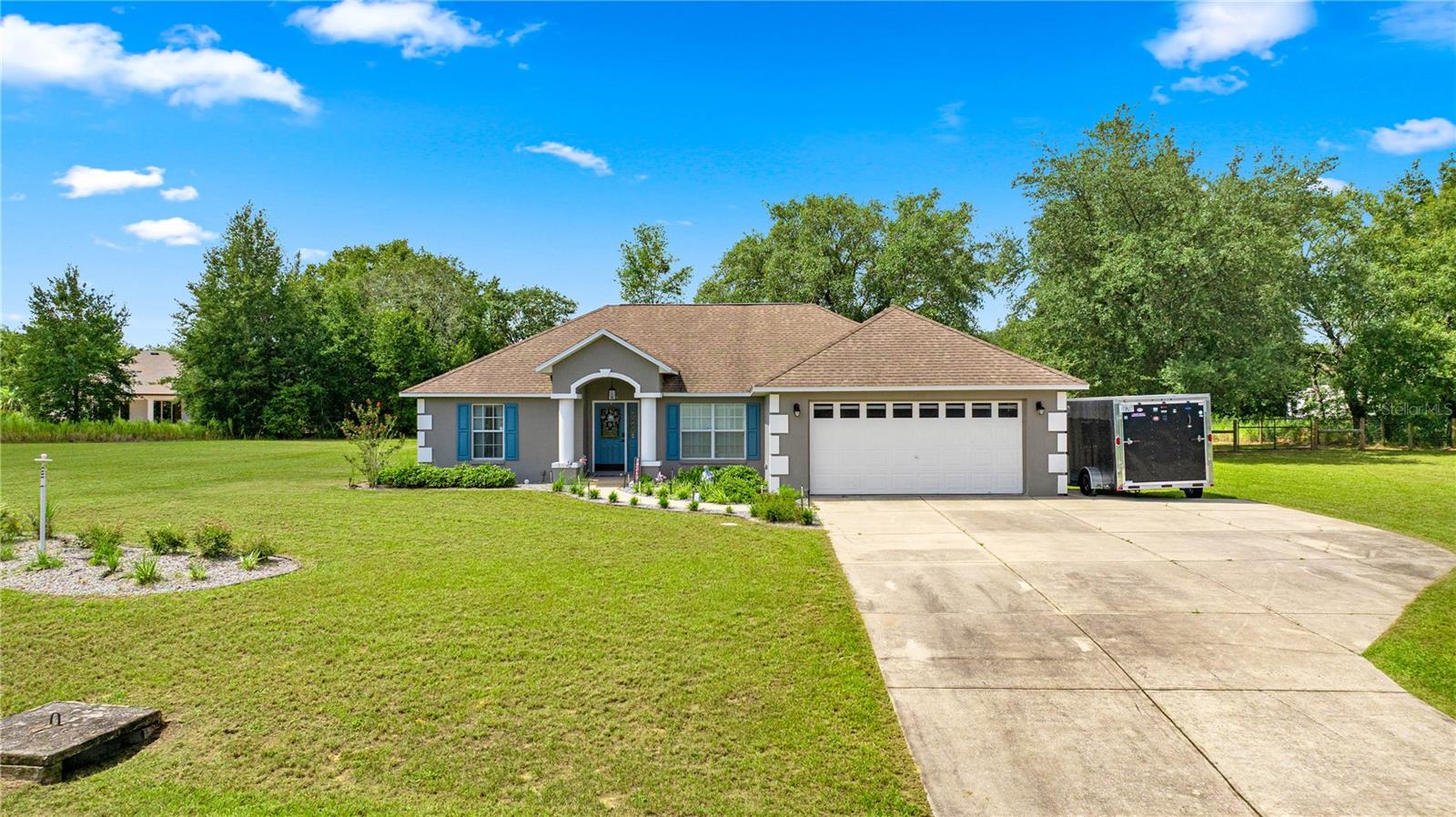 Welcome to your charming and modern sanctuary! This beautifully updated 3-bedroom, 2-bathroom home sits on a spacious 1.03-acre corner lot in the desirable Pine Ridge community, the largest equestrian center in Citrus County.
Step inside to a bright, open floor plan with vaulted ceilings and new LVP flooring throughout. The kitchen is ideal for cooking, featuring tile floors, ample cabinetry, a LG ThinQ refrigerator, a glass top stove, and an ice ball maker. A dedicated office space with high-speed internet is perfect for remote work. The split floor plan offers privacy, with a tranquil primary suite featuring a king-sized bedroom, walk-in closets, a soaking tub, and a large walk-in shower.
Outside, the large, gated backyard has plenty of room for your boat or toys, a central shade tree, and space to add a pool or workshop. Recent upgrades include a newly painted exterior, a fresh gray epoxy garage floor, and a serviced septic system.
Nestled in the rolling hills of Florida's Nature Coast, Pine Ridge Estates offers a lifestyle of outdoor enjoyment and convenience. The community boasts approximately 50 miles of equestrian trails, a well-appointed community center with daily activities, tennis courts, horseshoe pits, and a playground.
This home is perfectly positioned for adventure, just minutes from some of Florida's best outdoor activities, including swimming with manatees in Crystal River, kayaking down Rainbow Springs, and numerous hiking and birding trails.
You're also conveniently located just 1.5 hours from Tampa, less than 2 hours to Orlando, and only 45 minutes from downtown Ocala or the World Equestrian Center. This is more than a home; it's a gateway to an active Florida lifestyle!