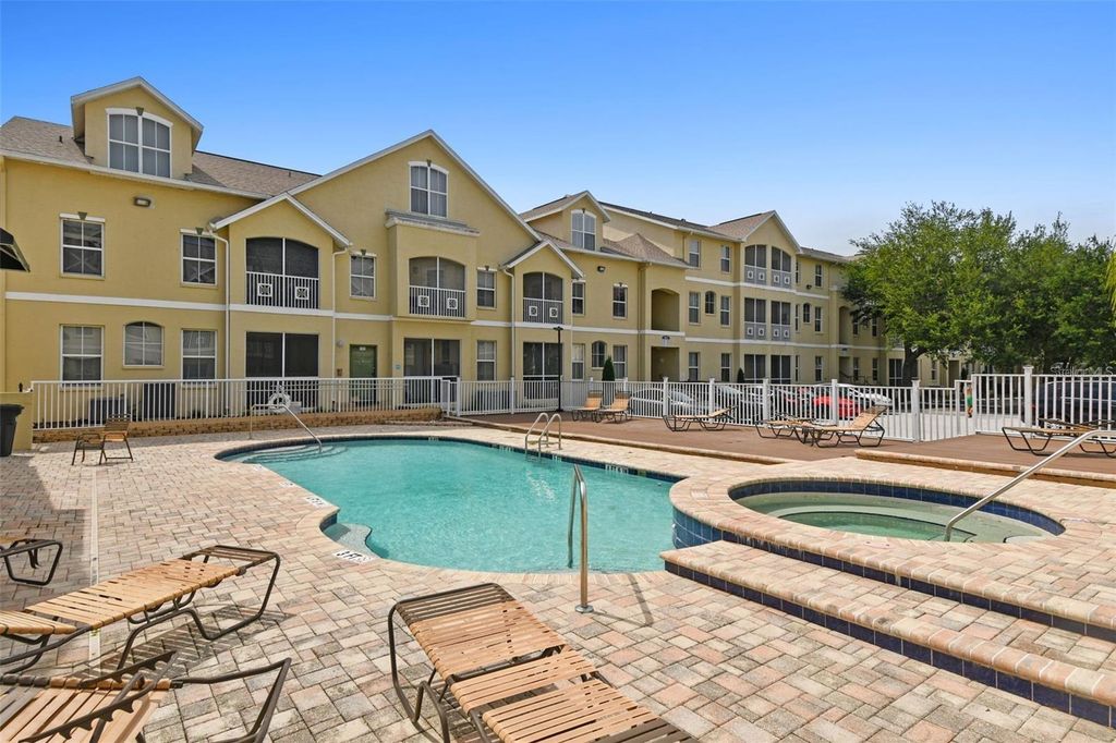 Photo of 5052 Sunridge Palms Drive #104, Tampa, FL 33617 (MLS # TB8497426)