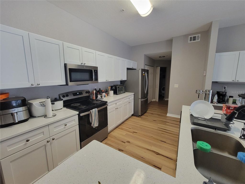 Photo of 5052 Sunridge Palms Drive #104, Tampa, FL 33617 (MLS # TB8497426)