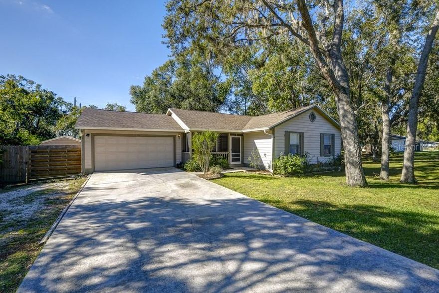 Welcome to your dream oasis in sunny Sarasota! Nestled on a nearly half-acre cul-de-sac lot, this 3-bedroom, 2-bathroom house offers the perfect blend of privacy and convenience.  This charming home sits  in a quiet enclave of just 64 homes in the deed-restricted neighborhood of Kensington Woods with mature landscaping and no through traffic. There is ample room for parking and a fully fenced backyard on this expansive lot featuring a fire pit, 8x10 storage shed, and a wide deck surrounded by dedicated green space that ensures nature will be your back door neighbor.  You will have plenty of room for gardening, lawn games, and a big gathering.  Add a pool or county-approved ADU (Additional Dwelling Unit) for additional living space or rental income.  
Inside, you will find a bright and open area adorned with french doors bringing in natural light to the kitchen, dining, and living room. Another set of french doors are in the roomy Primary Bedroom with an ensuite and walk-in closet.  The other 2 bedrooms are separated and share a second bathroom.  The classic kitchen has a view of the back lawn and leads to the laundry area in the garage that also currently serves as an extra living and sleeping space but could easily be utilized as parking if desired.
The true gem of this property lies in its comfortable and serene atmosphere while being in a central location. Imagine having your own park-like retreat while being just 5 miles away from the vibrant cultural scene of downtown Sarasota, 5 miles to the dining and shopping of University Town Center, and only 4.5 miles to I-75. When it's time to unwind, the world-famous beaches are nearby with breathtaking sunsets and endless recreational opportunities.
This is a move-in ready home with a new roof (Spring 2022) and HVAC (Summer 2023) that has been lovingly cared for and is available for the first time in nearly 20 years.  A seller credit is being offered for closing costs or cosmetic upgrades. Take your chance to own this slice of paradise! Experience Sarasota living in this peaceful blend of nature and cozy living space in an unbeatable location.