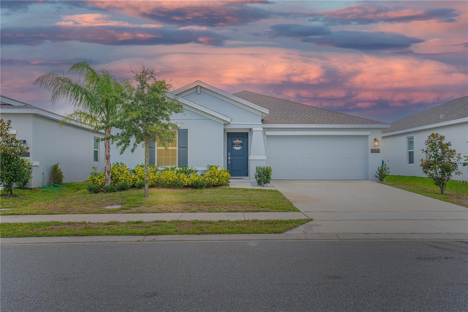 Welcome to Your Dream Life in Osteen! This immaculately kept 3-bed, 2-bath gem, built in 2023, is the perfect blend of modern comfort, family living, and small-town charm. Located in the highly sought-after A-rated Osteen Elementary school district, this home is more than just a place to live—it’s a lifestyle upgrade. Step inside to a bright, open-concept layout with a split floor plan that offers space and privacy for the whole crew. The heart of the home features wood plank tile throughout the living areas and bathrooms, plush carpet in the bedrooms, and a stunning board-and-batten accent wall with a cozy electric fireplace and mantel—perfect for movie nights or winding down after a day of fun. The spacious primary suite includes a walk-in shower, dual-sink vanity, tub/shower combo, and a huge walk-in closet that will make your morning routine a breeze. Additional perks? Inside utility room, 2-car garage, Access to a community pool & playground, and Tons of upgrades throughout! LOCATION, LIFESTYLE, & LOCAL LOVE: You’ll be just walking distance to Feel Good Farms—a local favorite winery, vineyard, and live music venue where weekends feel like mini vacations. Fancy fresh flowers or garden inspiration? Pell’s Nursery is right around the corner. And let’s not forget the legendary Skip’s Western Wear nearby for some Florida flair. Travel often? You’re just 17 minutes to Sanford Orlando International Airport and minutes from 417, making commuting a breeze and beach weekends at New Smyrna just a short drive away. Need modern convenience? You’re close to Walmart Supercenter, dining spots, and all the essentials while still enjoying that peaceful, suburban vibe. This home is gorgeous, tastefully upgraded, and offered at an amazing price. Whether you're raising a family, traveling for work, or just looking to enjoy the good life with a glass of wine and live music nearby—this home delivers. Come fall in love with Osteen—where country charm meets modern living, schedule to see this home today!