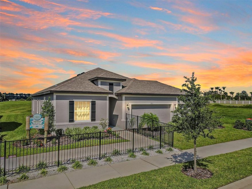 Welcome to 11822 June Briar Loop at the Mirada Lagoon Community. The Lagoon is open! This stunning 4-bedroom, 2-bathroom MODEL HOME built by Maronda Homes is move-in ready! As you enter the home, you'll be greeted by a spacious, bright living area seamlessly flowing into the dining and kitchen areas. The kitchen features granite countertops, stainless steel appliances, and ample cabinet space for all your storage needs. The master suite is a true oasis, boasting a large bedroom with plenty of natural light, a walk-in closet, and an ensuite bathroom with dual sinks, a garden tub, and a separate walk-in shower. Three additional bedrooms provide plenty of space for guests, and a second bathroom with a tub/shower combo provides added convenience. This 2,161-square-foot home also features quartz countertops, grey shaker-style cabinets, laminate flooring, a two-car garage, and a covered lanai, perfect for enjoying the beautiful Florida weather. Don't miss your chance to make this stunning model home your own! The home is currently being used as a model home, and the leaseback is in place for 7+ months. The tenant's rent is $3,458 per month. This lovely home is in the exclusive Mirada Lagoon Community. Rent includes cable + the fastest internet in the nation, Ultra-Fi, and the Crystal Lagoon Membership.The closest Elementary Schools are Innovation Preparatory Academy, a tuition-free charter school by Metro Development Group, and Pasco Elementary School. The nearest middle school is Pasco Middle School, and the nearest high schools are Kirkland Academy of Innovation High School and Pasco HS. LIFE AT THE LAGOON is like nothing else... The Mirada Lagoon Community features “Street Leaf” (solar streetlights), and a Crystal Lagoon Community (OPENING SOON), where Residents will soon have access to Paddle Boarding, Kayaking, a Wibit Obstacle Course, Cabanas, Sandy Beaches, Live Music Events, Swim Up Bar and Resident Only Events. The Lagoon is like an Outdoor Clubhouse. The planned Holiday/Seasonal Events include Trivia Night, Family Night, Movies on the Lawn, Sounds of Summer (live music series), Karaoke, Pumpkin Patch in November, Golf Cart parades, Cinco de Mayo Resident only celebration, Fourth of July Resident Only celebration and much more. The Mirada Community Amenities include dog parks and golf cart paths. This home is about 10 minutes from KRATE (the new outdoor mall), 20 minutes from the Tampa outlets, 35 minutes north of Downtown Tampa, 45 minutes from Tampa International Airport, and an hour and a half from Orlando and Walt Disney World. Available for Tours 7 days a week.