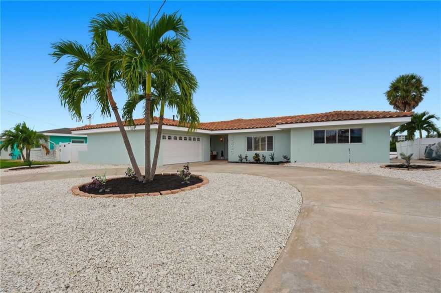 Welcome to your WATERFRONT dream home in the Pasadena Golf Club Estates of St. Petersburg! With a NEW kitchen, NEW bathrooms, fresh paint, NEW flooring in bedrooms, 2021 tile roof & MORE, this three-bedroom, two-bathroom residence, with a dedicated office, offers 84 feet of prime waterfront along the Intracoastal Waterway of Boca Ciega Bay, with deep-water access - a true boater’s paradise with easy access to Tampa Bay and the Gulf. Step inside to discover a beautifully renovated open floor plan. The light and bright living and dining areas capture serene water views, creating a relaxing coastal atmosphere. The dream kitchen features tons of all-new shaker-style cabinetry, QUARTZ countertops with a matching backsplash, and upgraded BESPOKE appliances — perfect for both cooking and entertaining. The spacious primary bedroom includes an en suite bathroom, while all bedrooms feature new wood-look tile flooring. Both bathrooms have been completely modernized with NEW vanities, mirrors, light fixtures, and hardware. Outside, enjoy Florida living at its best with a large outdoor space ideal for grilling, dining by the water, or relaxing on the dock while spotting local wildlife. Located in unincorporated Pinellas County, this home is just minutes from the Pasadena Yacht & Country Club, the vibrant shops and dining of Downtown Gulfport, and only 10 minutes to St. Pete Beach and 15 minutes to Downtown St. Petersburg. Live the ultimate Florida waterfront lifestyle - your new home awaits!