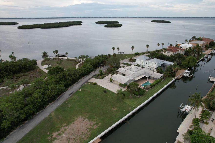 Rare near half acre (.48)  lot with bay and canal views! This Longboat Estates property features a brand new 155ft concrete seawall and allows for boating, fishing or simply incredible views from every angle. Located in a small neighbourhood central to Longboat Key, Longboat Estates has a private beach access directly across Gulf of Mexico Drive and is close in proximity to a park, hardware store, grocery, shopping and restaurants. Build your dream home with bay and canal views of Longboat Key. *Demolition is under way at this property and is expected to be completed by the end of 2023*