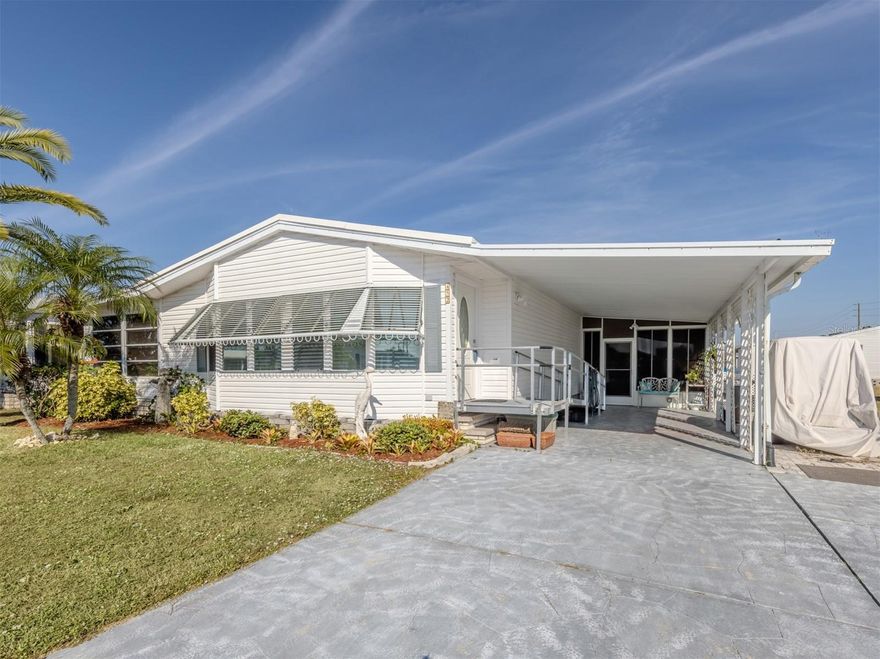 This spacious 2-bedroom, 2-bath manufactured home offers 1,566 sq ft of comfortable living on a quiet street in the desirable, land-owned and pet-friendly community of Harbor Isles. Designed for those who love to entertain, the home features a generous kitchen with stainless steel appliances, ample counter space, and room to gather. Both bedrooms are large and inviting, and the separate family room includes a wet bar, making it the perfect spot for hosting guests or relaxing after a long day. A bright and airy lanai extends off the living room, giving you even more space to spread out and enjoy Florida living.
The home has been well cared for, with a 2020 AC system and a 2019 water heater for peace of mind. It’s truly move-in ready and waiting for its next owner.
Harbor Isles is a highly regarded waterfront community known for its welcoming atmosphere and exceptional amenities. Residents enjoy a resort-style pool, fitness center, sauna, tennis and pickleball courts, bocce, shuffleboard, a marina with boat slips (when available), kayak and canoe launch, and a vibrant clubhouse offering endless social activities and gatherings. With its convenient North Port location and beautifully maintained surroundings, Harbor Isles makes every day feel like vacation.
This charming home offers comfort, space, and an unbeatable community lifestyle. It’s a wonderful opportunity to enjoy the best of Gulf Coast living.