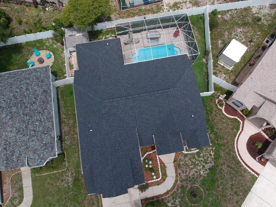 Tucked away on a quiet cul-de-sac in the desirable Hunters Lake community, this spacious 4-bedroom, 3-bath home offers a flexible layout and inviting outdoor living. Built in 2002 and featuring a newer roof (2022), the home also includes solar panels for added energy efficiency.

The main level welcomes you with formal living and dining areas, a den perfect for a home office or flex space, and an eat-in kitchen equipped with stainless steel appliances. Tile flooring runs throughout the home, with no carpet in the owner’s suite. The primary suite is a true retreat, featuring dual sinks, dual closets, a garden tub, and private access to the screened pool area.

An upstairs suite with a bedroom and full bath provides ideal space for guests or multigenerational living. Step outside to enjoy Florida living at its best with a screened and enclosed pool, 6 feet deep, complete with a hot tub, perfect for relaxing or entertaining year-round. The backyard also includes a convenient storage shed.

With a 2-car garage, no CDD fees, and a central Pasco County location close to shopping, dining, and major roadways, this home combines comfort, function, and lifestyle in one exceptional offering.