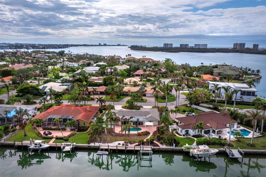 Discover an extraordinary opportunity to reimagine waterfront living on Bird Key, one of Sarasota’s most coveted neighborhoods. This prime canal-front property boasts 100 feet of waterfront, making it ideal for boating enthusiasts. It can accommodate a 70-foot vessel, and the existing boat lift is designed to handle boats up to 26 feet. With direct access to the bay, it offers the perfect setting for embracing the area’s renowned nautical lifestyle. Located just moments from St. Armands Circle’s vibrant shopping and dining, the pristine sands of Lido Beach, and the cultural attractions of downtown Sarasota, this home blends convenience with prestige. The existing 3-bedroom, 2-bathroom residence spans approximately 2,762 sq. ft. and has been well maintained by its longtime owners. Featuring an open, sparkling pool with a paver deck, the home is well-suited for outdoor entertaining amid the tranquil waterfront ambiance. While the property will require updates to reach its full potential, it offers a blank canvas to design the personalized retreat of your dreams. Residents have the option to join the exclusive Bird Key Yacht Club, offering premier boating facilities, waterfront dining, fitness amenities, and a vibrant social calendar, further enriching the unparalleled lifestyle of this prestigious community.