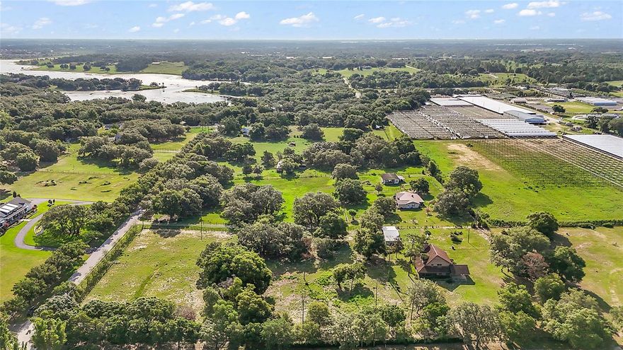 Huge price reduction and priced to sell! Experience the peaceful lifestyle of Lake Avalon Groves with this rare opportunity to own 4.46 acres of versatile land in a prime location, close to everything, yet tucked away from the hustle and bustle with no HOA. This property features a 2,330-square-foot home built in 1986, offering three bedrooms and 2.5 bathrooms. The home is a fixer-upper, perfect for renovation or taking advantage of the land to build your custom primary home or add a secondary residence. With A-1 agricultural zoning, the possibilities are endless. Bring your horses, cattle, goats, chickens or start your own farm or garden. Enjoy wide open space, privacy and rural charm. Utilities are already in place. Electricity, cable, well and septic are already at the property, making this property ideal for a tear-down and rebuild or expansion with a second home, saving significant time and development costs. The property is in a prime location, roughly four miles to Hamlin Town Center and Orlando Health Horizon West Hospital, roughly eight miles to historic downtown Winter Garden & Farmers Market, 10 minutes to Highway 429, roughly 20 minutes to Disney, Universal, major attractions and theme parks and 30 minutes to downtown Orlando. Enjoy the best of both worlds with serene country living with convenient access to shopping, dining, healthcare, theme parks and top-rated schools. Whether you’re a builder, investor, renovator or nature lover, this property offers incredible potential. Schedule your private showing today; opportunities like this in Lake Avalon Groves are rare.