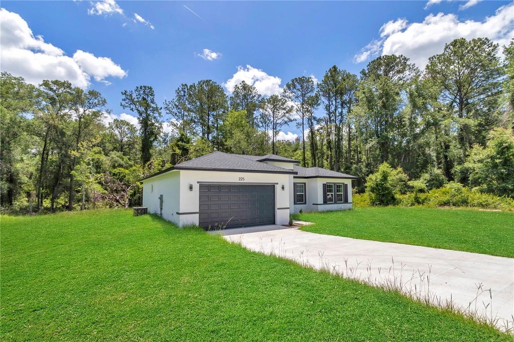 Photo of 225 E Caldwell Drive, Dunnellon, FL 34434 (MLS # O6414777)