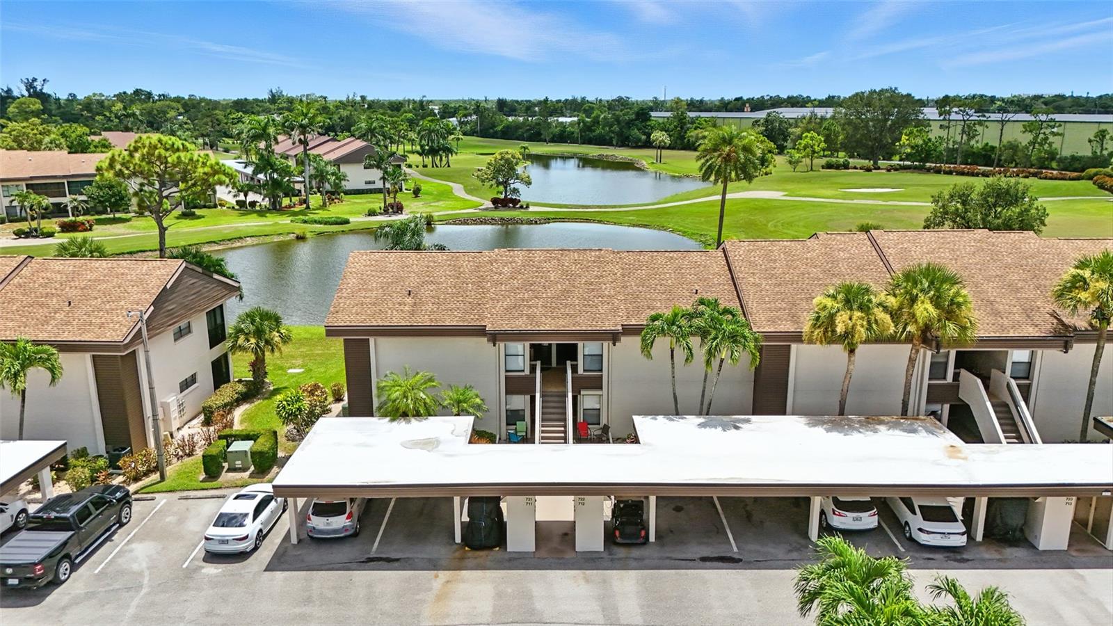NO DAMAGE OR FLOODING FROM ANY HURRICANES!! Nestled in the heart of Fort Myers’ prestigious Hideaway Country Club, this radiant Merion Village condo beckons with unparalleled elegance and serene vistas. Awake each morning to breathtaking, unobstructed views of a glistening twin lake and the lush, rolling fairways of an award-winning 18-hole golf course, masterfully designed to inspire. This first-floor sanctuary boasts a versatile sunroom/solarium, bathed in natural light, offering year-round comfort and additional living space—perfect for morning coffee or evening relaxation. Fortified with automatic roll-down hurricane shutters on all sliding doors, this home offers peace of mind and proudly emerged unscathed from Hurricane Ian and all prior storms. Step inside to discover a sophisticated neutral palette, ready for your personal touch, complemented by rich wood cabinetry that infuses warmth into the gourmet kitchen. Granite countertops cascade seamlessly paired with matching appliances and abundant storage for effortless entertaining. Both bathrooms exude luxury with granite finishes, the guest bath elevated by matching wood cabinetry, while the expansive primary suite offers a generous walk-in closet for ultimate convenience. An in-unit washer/dryer ensures daily ease, leaving more time to indulge in the resort-style amenities that define Hideaway living: championship golf, pristine tennis courts, a sparkling community pool, a state-of-the-art fitness center, and a stunning new clubhouse featuring a pro shop, restaurant, and bar. Just minutes from RSW Airport, premier shopping, eclectic dining, a modern movie theater, and the renowned Barbara B. Mann Performing Arts Center, this condo is a gateway to the vibrant Fort Myers lifestyle. Seize the chance to own a slice of paradise in one of the city’s most coveted communities—where luxury meets tranquility at its finest and in Desirable Zone "X".