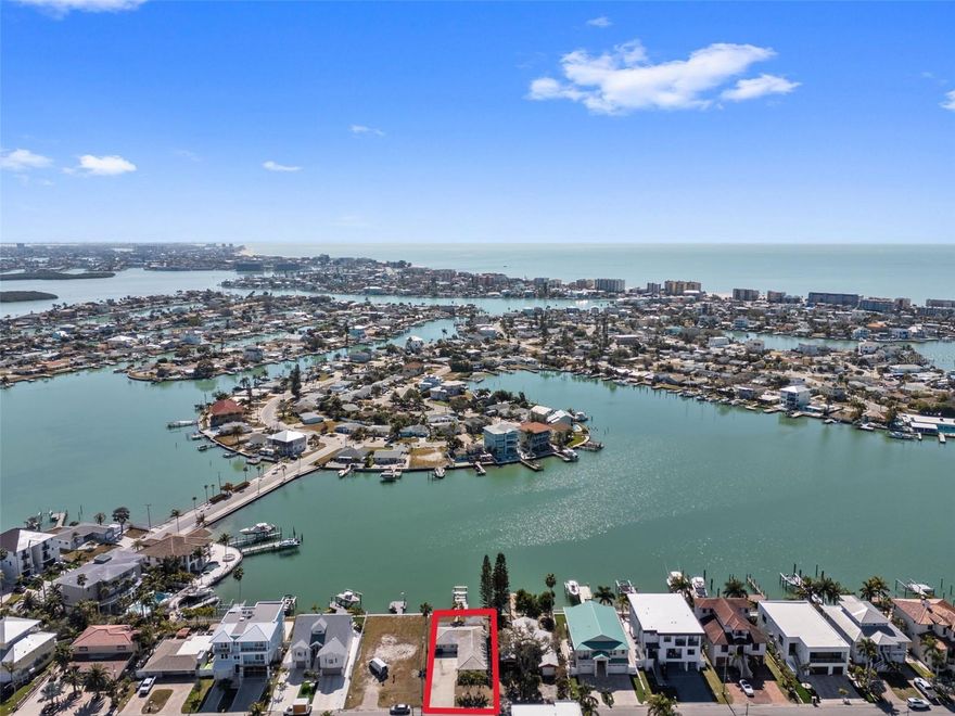 An exceptional opportunity awaits in one of Madeira Beach’s most coveted waterfront neighborhoods. Located at 837 Bay Point Drive, this 60 x 125 deep-water canal lot offers the ideal canvas to design and build a luxury coastal residence tailored to your vision. Set among elegant, high-end homes, this neighborhood is rebuilding with beautiful elevated homes —making it one of the most desirable enclaves on the barrier island.  This lot has a home that has been substantially damaged. 
The lot’s deep 125-foot footprint allows for a thoughtfully designed home with generous interior living space, expansive outdoor areas, and seamless indoor-outdoor flow. 
Positioned on a tranquil canal with deep water, a newer dock and seaway with direct access to the Intracoastal Waterway and Gulf of Mexico, this waterfront setting is ideal for boating enthusiasts. Enjoy the convenience of keeping your vessel just steps from your back door while taking advantage of protected waters perfect for daily cruising, paddleboarding, or kayaking. 
World-class beaches, vibrant waterfront dining, boutique shopping, and Johns Pass Village are all just minutes away. Despite its close connection to island amenities, the neighborhood maintains a peaceful residential feel, making it ideal for a primary residence or a luxury second home.
Bring your architect, builder, and imagination—837 Bay Point Drive is your opportunity to create a timeless waterfront estate in one of the area’s most exclusive settings.