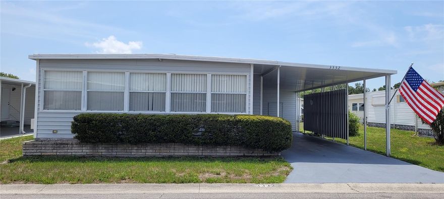 Seller Motivated!! - Big Price Reduction for this Comfortable Bungalow style 2 bed 2 bath home located in the ONLY Resident Owned Park in the City limits of Sarasota!! 
The kitchen is quite spacious and has a pantry with additional storage cabinet. Dining room is adjacent to the kitchen and living room and has an oval table set and bamboo design double server that opens to give additional buffet style serving space. The living room has a newer reclining sofa and chair set, flat screen TV and other furnishings.  Just off the living room are sliders to the large Florida Room with wall to wall windows and a separate entry door. This North facing Florida room allows for shading/all day use. The primary suite has 2 twins that can be made into a king and dresser set. There is a walk in closet and wall closet with decorative doors. The en suite bath has a single vanity and step in shower.  The guest bedroom has 2 twin beds and decorative closet doors as well.  The guest bath is has vanity, tub/shower combo and linen closet. The washer/dryer are housed in the large shed along with a utility sink and lots of storage space/shelves. AC and water heater are older but running just fine. Main rooms have Berber carpet, kitchen and baths have linoleum and Florida room has outdoor carpeting. 
Updates: Main house has a Galv Metal Roof Over with lots of life span left, the Florida Room has an Elastomeric Roof Over. installed 2010. Both roofs were inspected in 2023. Most windows have been updated, the East and South windows have hurricane shutters.  Sewer line was replaced 2017.  
The gated 90 acre community boast low maintenance fee with its vast amenities starting with the large Clubhouse outfitted with a full commercial cook kitchen, event stage, audio/visual, dance floor, fitness room, activities hall, library with books/movies/puzzles and a pool table. Outside recreation includes an extra large heated pool with a handicap ramp, a spacious kidney shaped hot tub, ample tables and lounge chairs and remodeled shower rooms. Oak trees shade the beautiful park area, Gazebo, picnic tables and a community grill. Additional amenities to enjoy are the community putt putt course, bocce ball, ping pong, horse shoes and corn hole. Oakwood Manor is a highly social community with many groups and activities to be a part of. We are located adjacent to Legacy Trail and 12 new pickle ball courts managed by the City.  Close to downtown, shopping and dining. Please note that Oakwood is a NO pet and NO motorcycle Park.