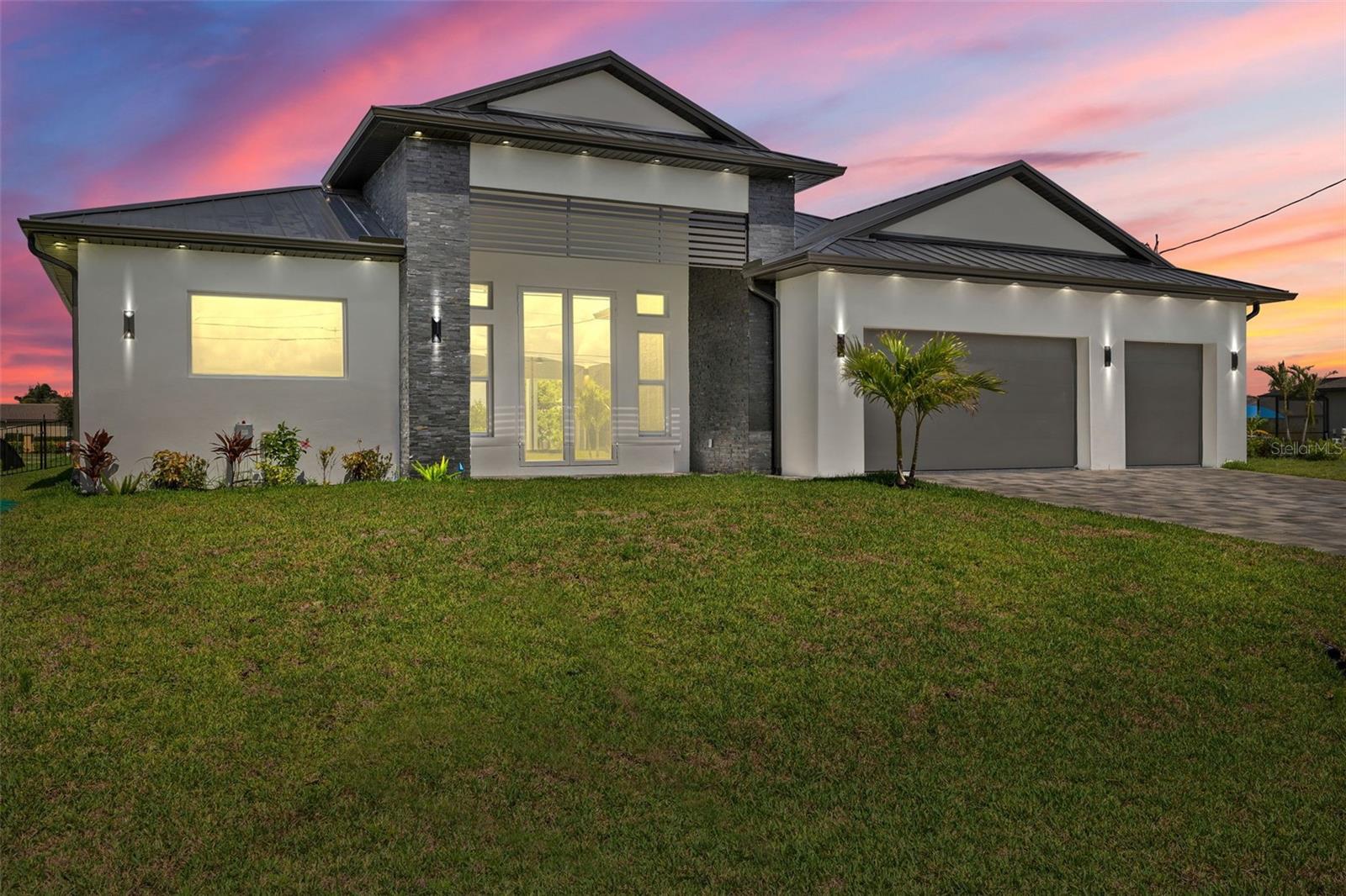 One or more photo(s) has been virtually staged. Experience exceptional craftsmanship and the ultimate Florida lifestyle in this brand new, custom-built home located in the fast-growing Northwest Cape Coral area.Thoughtfully constructed with energy-efficient ICF (Insulated Concrete Form) walls and a sleek metal roof, this brand-new home offers lasting durability, modern style, and exceptional comfort. Boasting 3 bedrooms + a den, 3 full bathrooms, and a spacious 3-car garage, this 2,869 sq. ft. home is designed for both luxurious living and everyday functionality. Inside, you'll be greeted by soaring 14-foot ceilings, impact-resistant windows and doors, elegant tile flooring throughout, and refined architectural details.
The chef-inspired kitchen is a true showpiece, featuring premium Wolf/SubZero appliances, Quartzite countertops, a large hidden walk-in pantry, and custom built-in cabinetry. The primary suite offers a serene escape with custom built-in closet systems that combine style and practicality. Step outside to your private oasis: a heated pool and spa, a fully equipped outdoor grill station—perfectly positioned along the 95-foot-wide Jai Lai Canal with GULF ACCESS . Enjoy breathtaking western exposure and tranquil water views that create the ideal backdrop for entertaining or unwinding at sunset. Additional features include a whole-house reverse osmosis system, smart-home technology, and high-end finishes throughout. This is more than just a home—it's a statement in waterfront luxury. Don’t miss the opportunity to own a piece of Cape Coral’s most desirable and fastest-growing community. Schedule a tour today and see it for yourself!