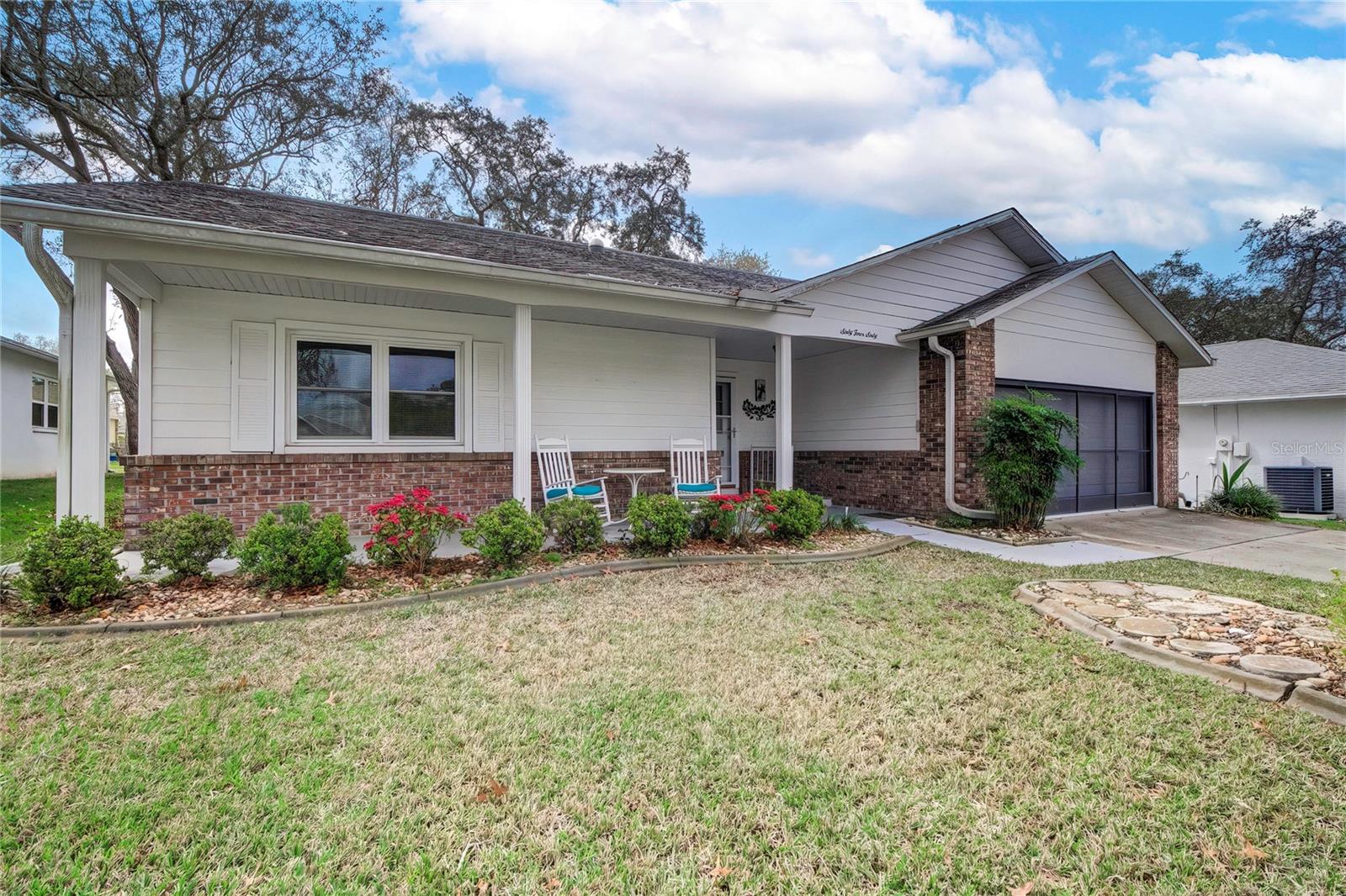 Florida Lifestyle Timber Pines Gate community in this 55+ golf course community this 2-bedroom 2 bath split floor plan 2-car screened garage, lanai, and a large covered front porch on a quiet street in the sought after Timber Pines Community awaiting its next owner in this fully furnished ready to move ready home. When entering the open floor plan there is a nice slider to the lanai with windows which allows you to enjoy your coffee with or without a breeze, there is a pass-through window to the kitchen. The owner's suite is large with a walk-in closet and bath off the suite has double sinks a shower with a built-in seat. The guest bedroom has a large closet with 2 beds that can easily be put together for the king size bed the guest bathroom has a tub/shower combo. Timber Pines is a 55+ community with over 100 clubs, restaurant/bar, 1 regulation golf course, 2 executive golf courses and a pitching 9-hole course, tennis courts, pickle ball, wood working shop, a new fitness center, dog park, 2 swimming pool this is truly a golf cart friendly community. The area is near shopping, restaurants, hotels, come enjoy the Natures Coast close to the Gulf of Mexico Weeki Wachee home of the world-famous mermaids near Pine Island for those beautiful sunsets around 40 minutes from Tampa or head north to Crystal River.