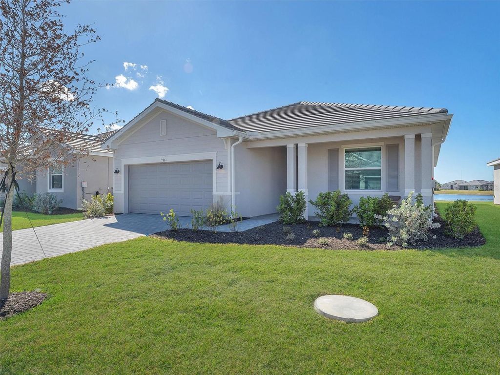 Photo of 7961 Lakes Edge Lane, Port Charlotte, FL 33981 (MLS # O6374940)
