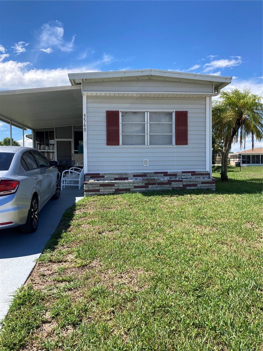 This sweet 2 bedroom, 1 bath turnkey furnished home is located in the fun and very active Holiday Park. As you enter the home, on your right, is the eat-in kitchen which is quite spacious. To your left is the living room, which is the perfect spot to enjoy a good ball game with your friends. The sliding door in the living room leads you out to the patio. The bright and airy sunroom is under air, so curl up with a book or play a board game in comfort. These main living areas have wood laminate flooring. There is carpeting in the bedrooms. The bathroom has a tub/shower combination. Owner financing may be available.
The community has tennis, pickleball, pool, shuffleboard, horseshoes etc. There are too many activities to list them all, so feel free to visit their website.
