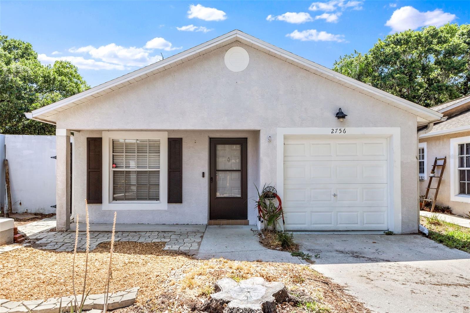 Welcome home to this beautiful 3-bedroom, 2-bathroom gem in the highly sought-after Hidden Grove Court community! This place has it all, including whole home solar potentially reducing your monthly utility costs by hundreds of dollars! This meticulously updated residence is situated on a serene cul-de-sac and occupies an expansive lot. As you step inside, you will immediately appreciate the high ceilings and abundant natural light that create a warm and inviting atmosphere. The kitchen has been fully updated featuring stainless steel appliances, tile backsplash, contemporary light fixtures, and concrete countertops. The primary bedroom features an ensuite bathroom and walk-in closet. The newer laminate flooring throughout the home ensures it is truly move-in ready. Included in the monthly rent is access to the home's electric solar panel system, potentially reducing your monthly utility costs by hundreds of dollars during the peak summer months. The location of this property is exceptionally convenient, with close proximity to Honeymoon Island, Downtown Dunedin, the Pinellas Trail, Countryside Mall, award-winning restaurants, and TOP-RATED schools. The open floor plan is ideal for entertaining, allowing you to create lasting memories with family and friends. The sizable, fully fenced backyard is adorned with mature oak trees and includes a screened lanai, perfect for enjoying Florida's beautiful evenings. Do not miss the opportunity to make this residence your home. Available for immediate move-in.