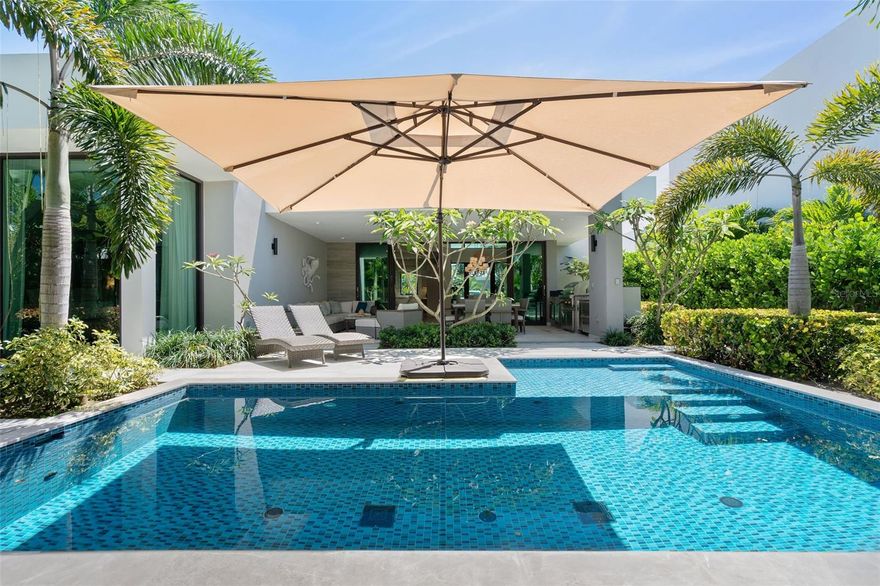 This beautifully curated one-story residence is a private tropical retreat, set on an 883-square-meter lot with approximately 3,550 square feet of gross construction and 2,500 square feet of conditioned living space in the The Isles, a community within the Dorado Beach Resort and Club. From the moment you arrive, the home feels like a beach sanctuary where mature landscaping surrounds the property, creating a sense of privacy and tranquility that feels both natural and established. Designed for seamless indoor-outdoor living, the residence opens to a resort-style outdoor area featuring a private pool, covered terrace, outdoor shower, and built-in BBQ kitchen space including a Wolf Grill, perfect for entertaining or relaxed island living. A double-car garage plus a separate golf cart garage adds convenience and functionality to take you within the 2,700 acre resort. Inside, the home reflects a refined yet relaxed beach aesthetic, thoughtfully curated with designer wallpaper, elegant lighting fixtures, and elevated finishes throughout. The interior design vision, guided by renowned Puerto Rico designer Caro Banazar, brings cohesion and warmth to every space, striking the perfect balance between sophistication and coastal comfort. The kitchen is both beautiful and highly functional, featuring marble backsplash detailing, a gas cooktop for the serious chef, and premium Thermador appliances. Altogether, this residence blends tropical serenity with intentional design, offering a home that feels private and polished.