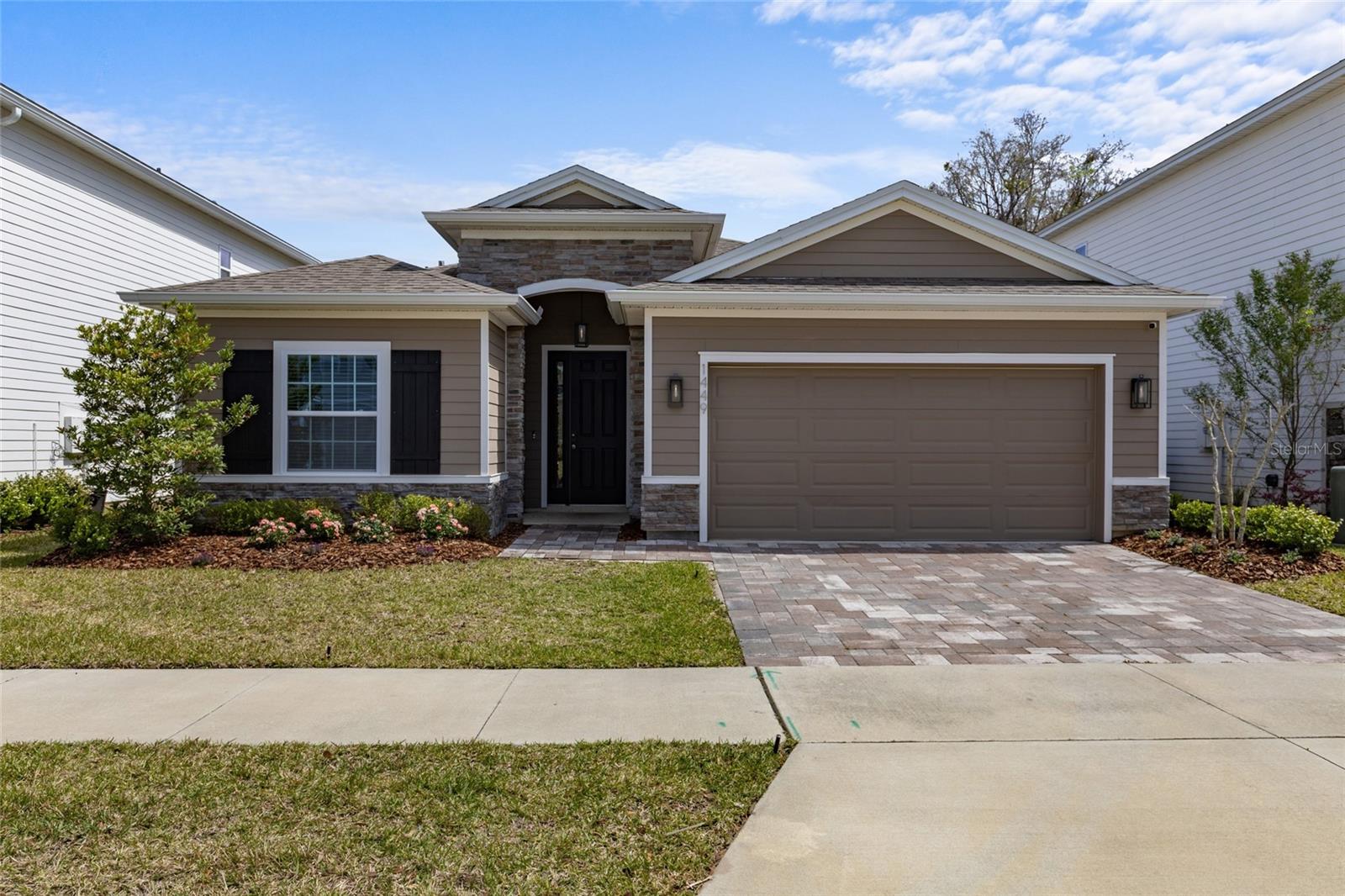This property with 4 Bedrooms and 2.5 Baths in the desirable Arbor Greens community offers an incredible blend of luxury and convenience. The home boasts an open concept family room that’s great for hosting and entertaining, four generously sized bedrooms, and 2.5 bathrooms, including a powder room for guests. The home is packed with HIGH-END FINISHED such as GRANITE countertops, elegant WOOD-LOOK Tile flooring in the main living areas, and modern outdoor lighting. The private primary suite serves as a serene retreat, complete with dual sinks, granite countertops, a relaxing garden tub, a separate walk-in shower, and his-and-her walk-in closets. Outside, the home comes with a screened lanai, a fully fenced yard that’s freshly sodded, and essential features like gutters, garage storage, a WASHER, DRYER and a Refrigerator. The sellers have invested to make this a smart home including a Nest smart front door lock, doorbell, and thermostat as well as a full security system with cameras and a TESLA charger. As a resident of Arbor Greens, you will also enjoy access to a community pool, playground, and the convenience of hassle-free front yard maintenance. The home's location is unbeatable, with quick access to I-75, HCA Hospital, Shands Hospital, the University of Florida, and the Town of Tioga's vibrant shops and restaurants. Renters Insurance Required.